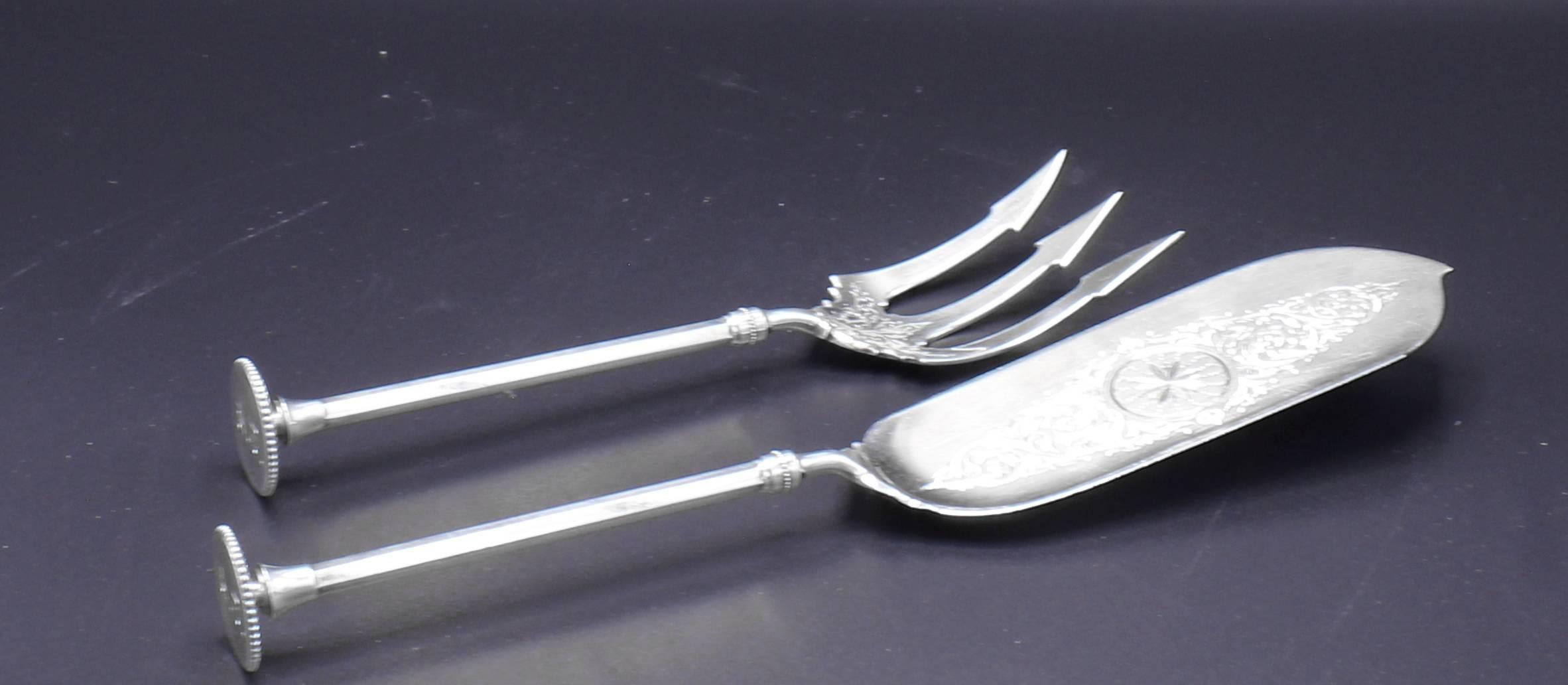 From the New York firm Benedict Brothers this unusual fish serving set it is original fitted box. Sterling silver 8.35 ounces, Fork 9 inches,  11.5 inches