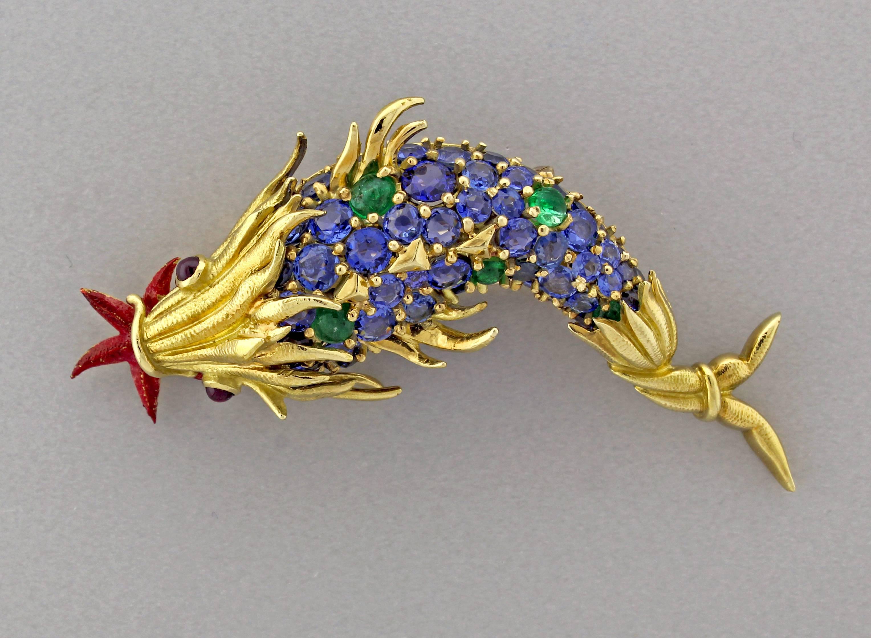  From acclaimed Tiffany & Co. designer, Jean Schlumberger, his iconic fish brooch. Meticulously crafted in 18 karat yellow gold the brooch exemplifies the artistry of Jean Schlumberger.
     