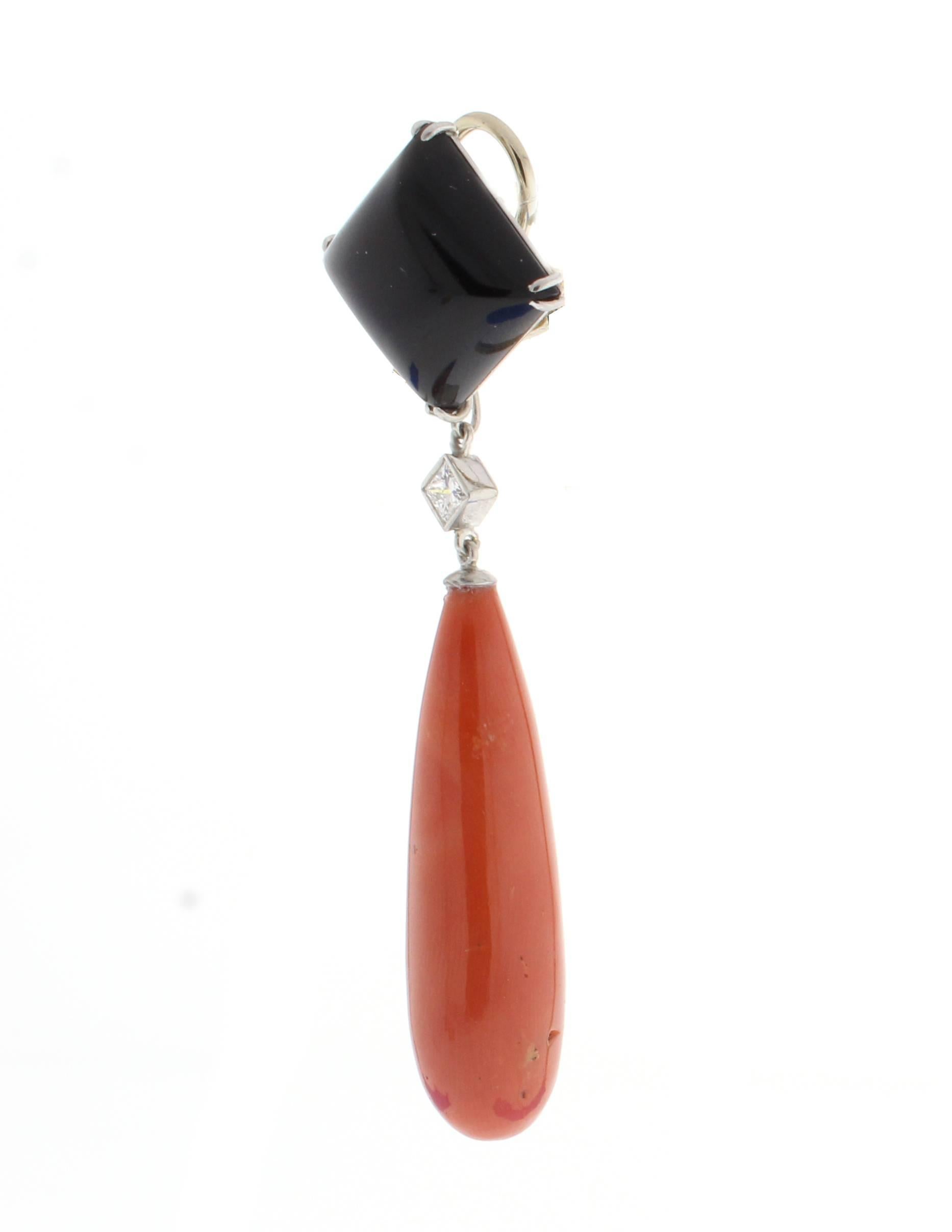 From Pampillonia Jewelers, a dramatic pair of coral black onyx earrings. The earrings feature a 2½ inch coral drop  suspended from a ½ inch cushion black onyx.  The two princess cut diamonds weigh .47 carats. 2¾ long. Handmade in platinum by