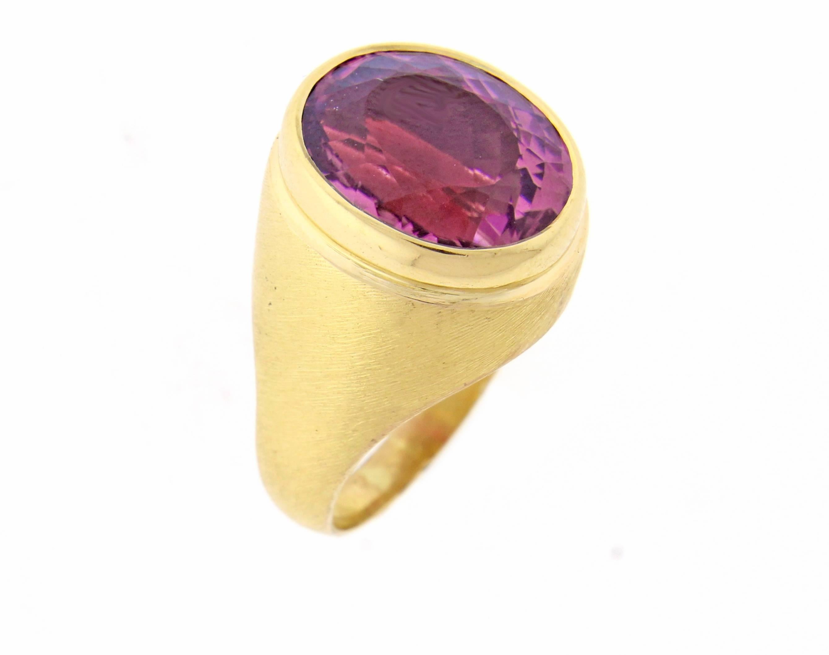 Brushed 18 karat gold pink tourmaline by by world renowned Brazilian jeweler Haroldo Burle Marx. The oval raspberry pink Tourmaline measures  14.5*12.5mm  weighing  21 carats.  Size 7.5 adjustable
