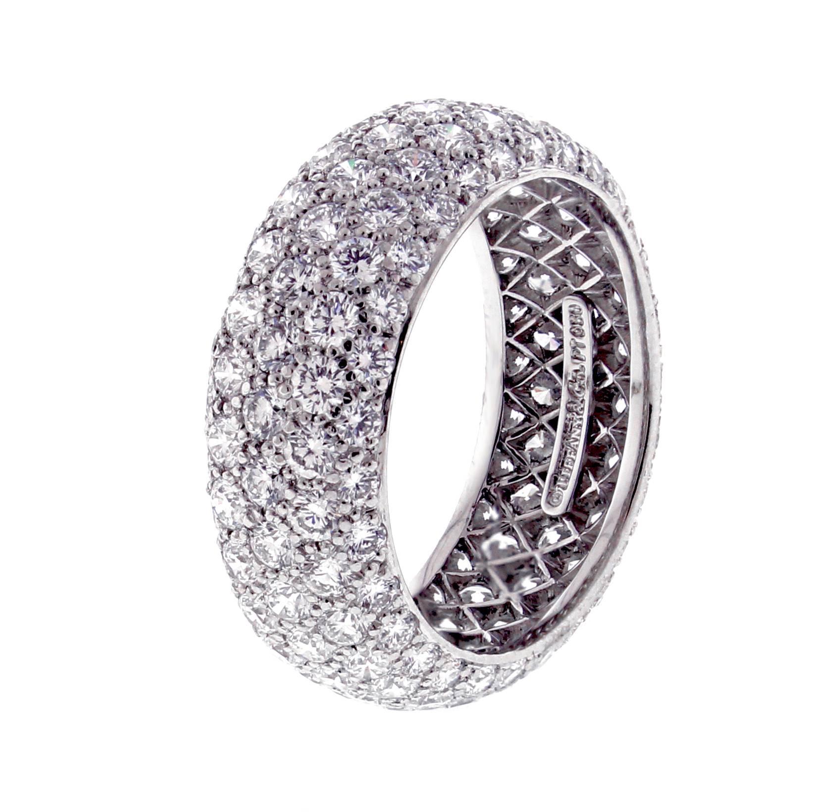 From Tiffany and Co.'s Etoile collection, a five-row band ring with 3.3 carats of round brilliant pavé-set 
Tiffany diamonds in platinum.  7½mm wide,  size 7