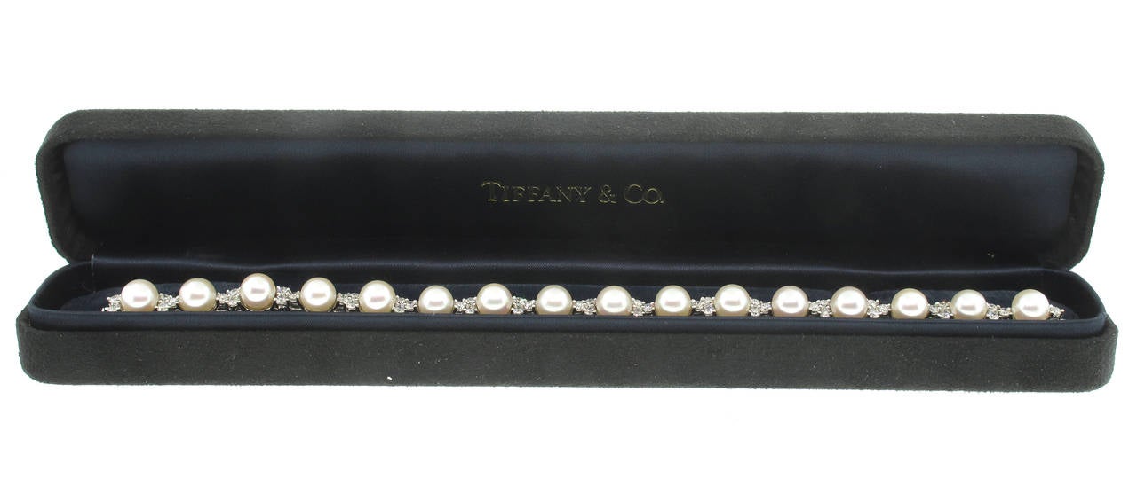 Three brilliant diamonds set in perfect harmony. A bracelet sixteen 6.5-7 mm Akoya cultured pearls and 48 round brilliant diamonds weighing 2.18 carats in platinum. 7