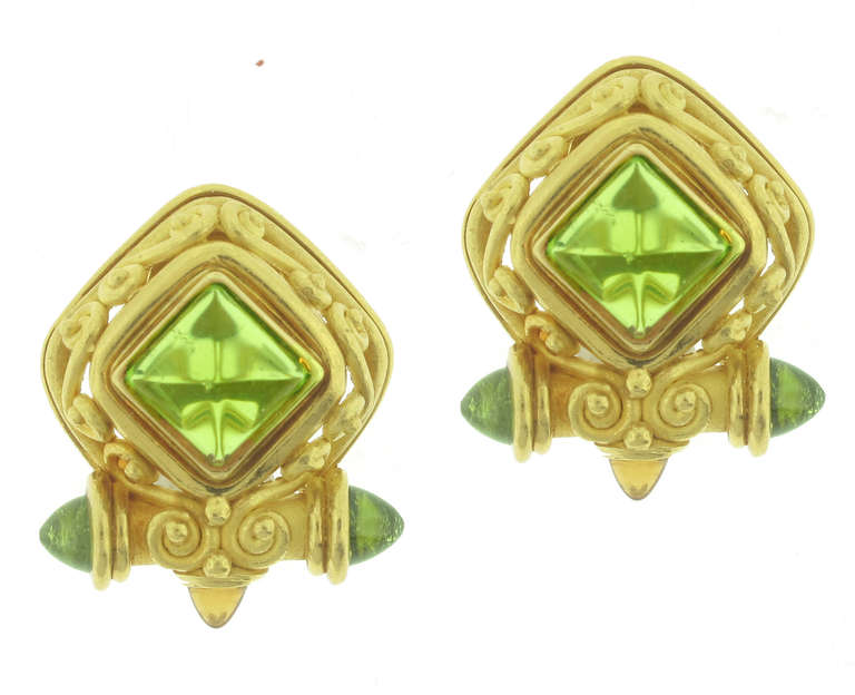 These Denise Roberge Gold, Citrine and Peridot Earrings are 22 karat yellow gold and feature peridots and citrines. These earrings weigh 27.2 grams. These earring are 1 inch in length and 3/4 of an inch wide.

California jewelry designer Denise