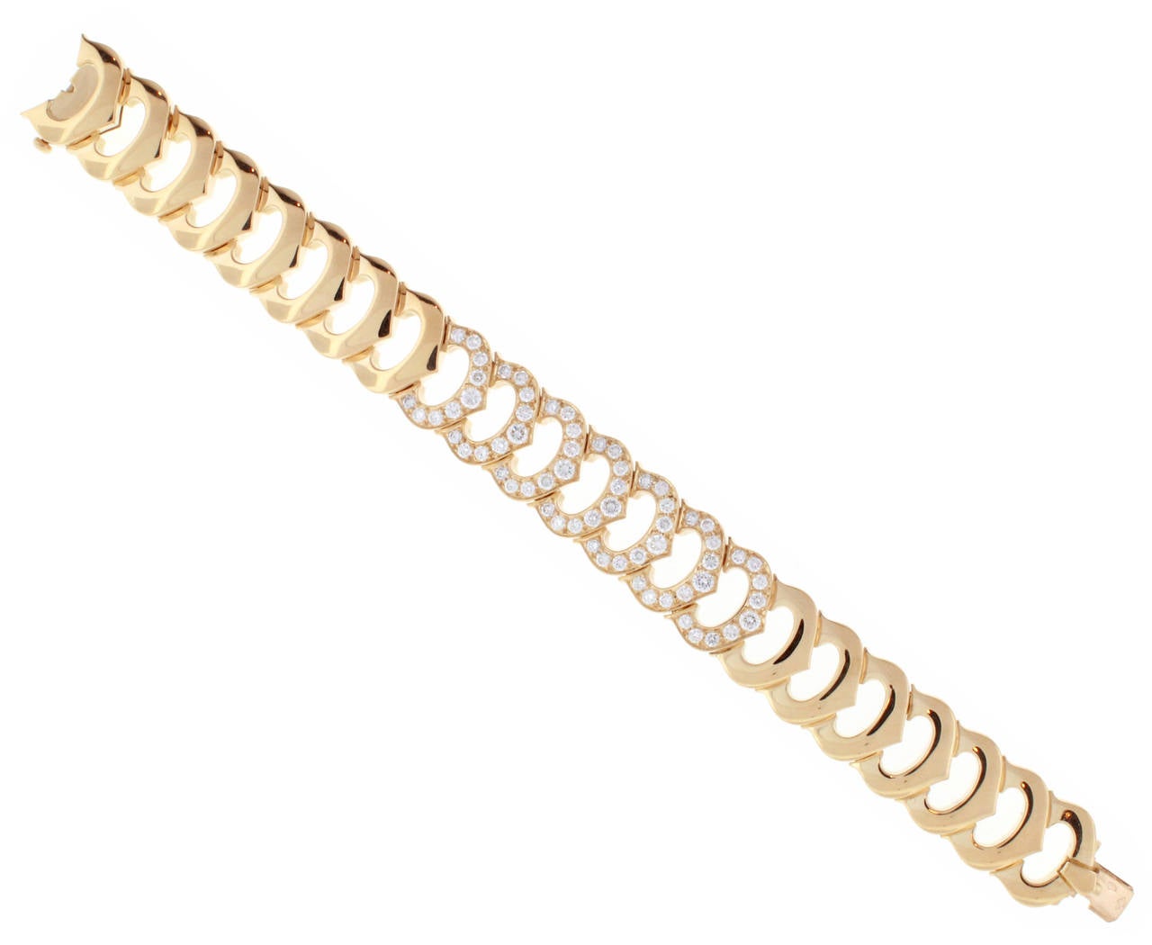 The classic Cartier design, set with seven diamond C links. The 63 diamonds weigh 3 carats E-F color and VVS clarity. 6 1/2 inches  Certificate of Authenticity