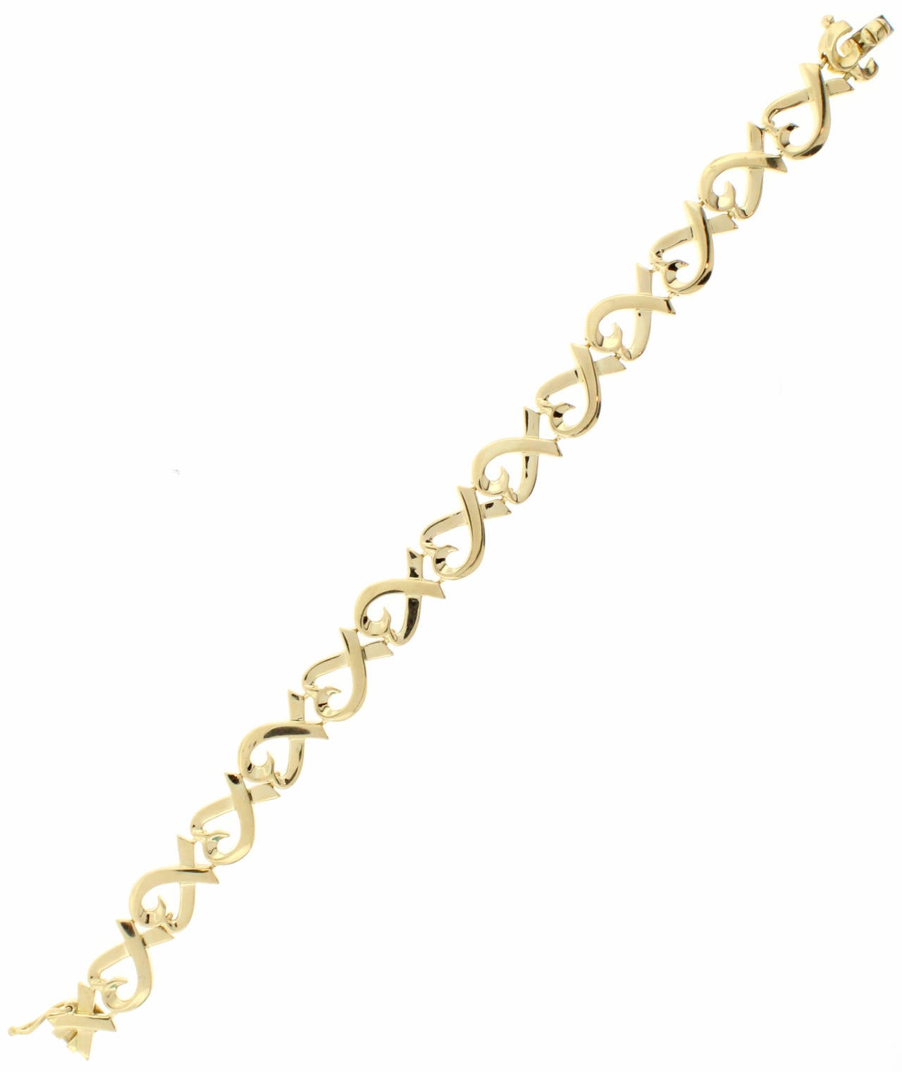 This Tiffany & Co. Paloma Picasso Loving Heart Bracelet is made of 18 karat yellow gold and is in excellent condition.