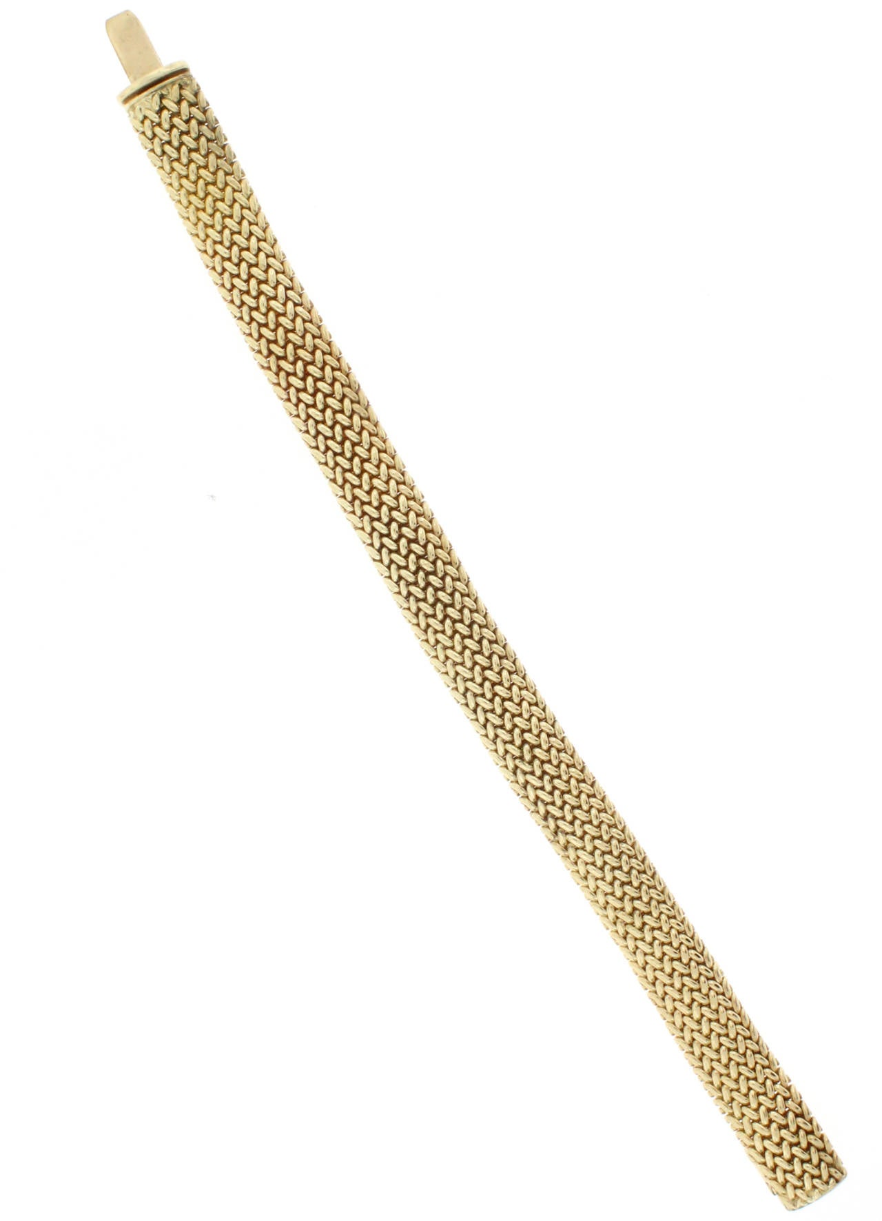 This Tiffany & Co. mesh bracelet is 9.5 millimeters in width and is 18 karat yellow gold.  32 grams