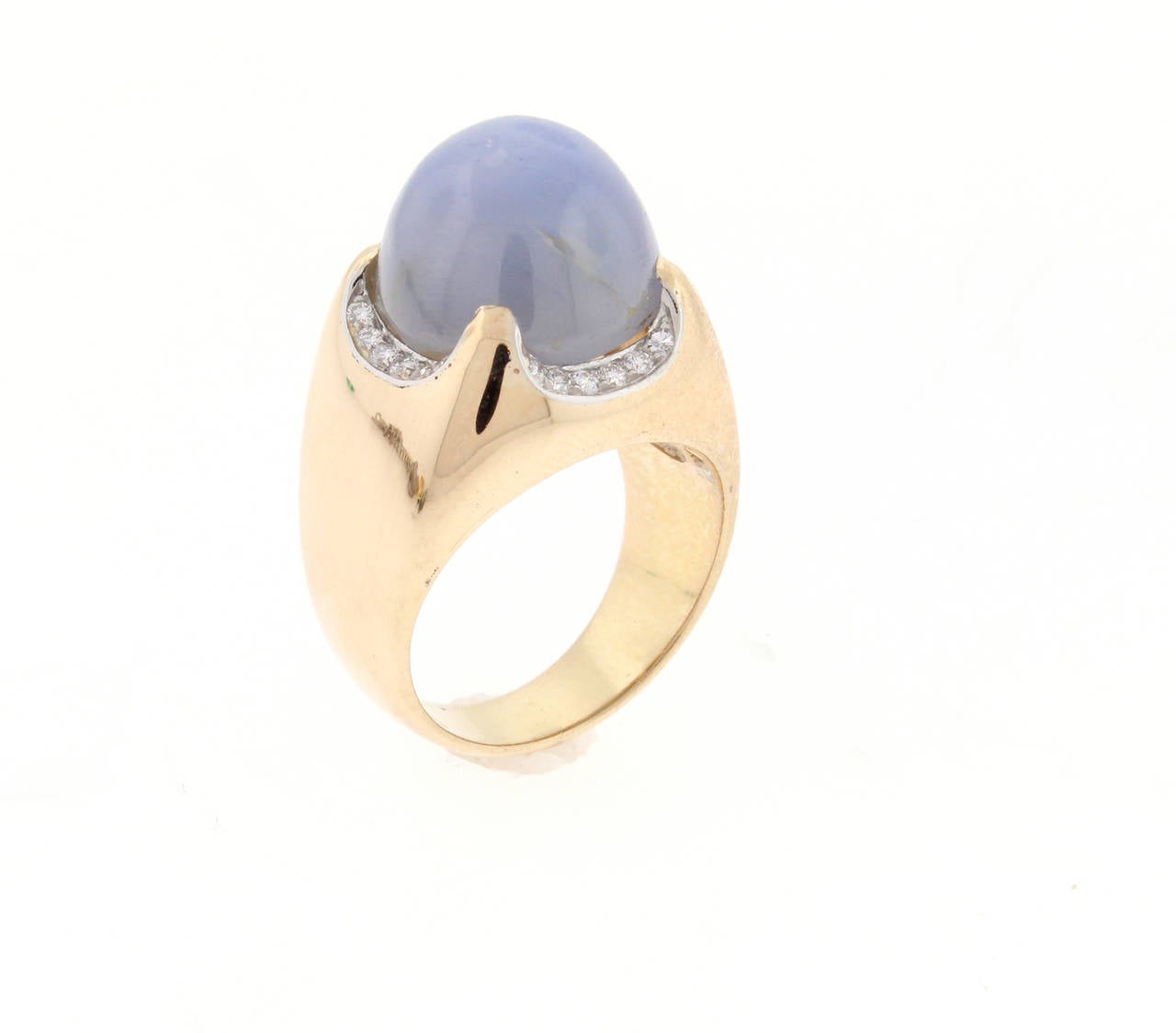 The cabochon greyish blue star sapphire weighs approximately 26 carats and is framed with 24 brilliant diamonds weighing .24 carats. Crafted in 18 karat pink gold the ring exemplifies Bulgari's sophisticated design and style. size 9 can be resized