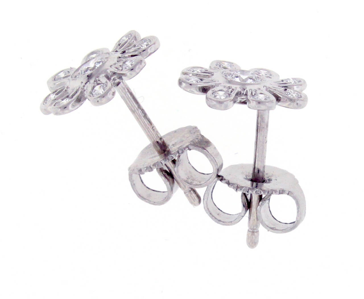 Delicate  diamond flower earrings by Tiffany & Co, 18 diamonds weighing.18 carat, set in platinum.