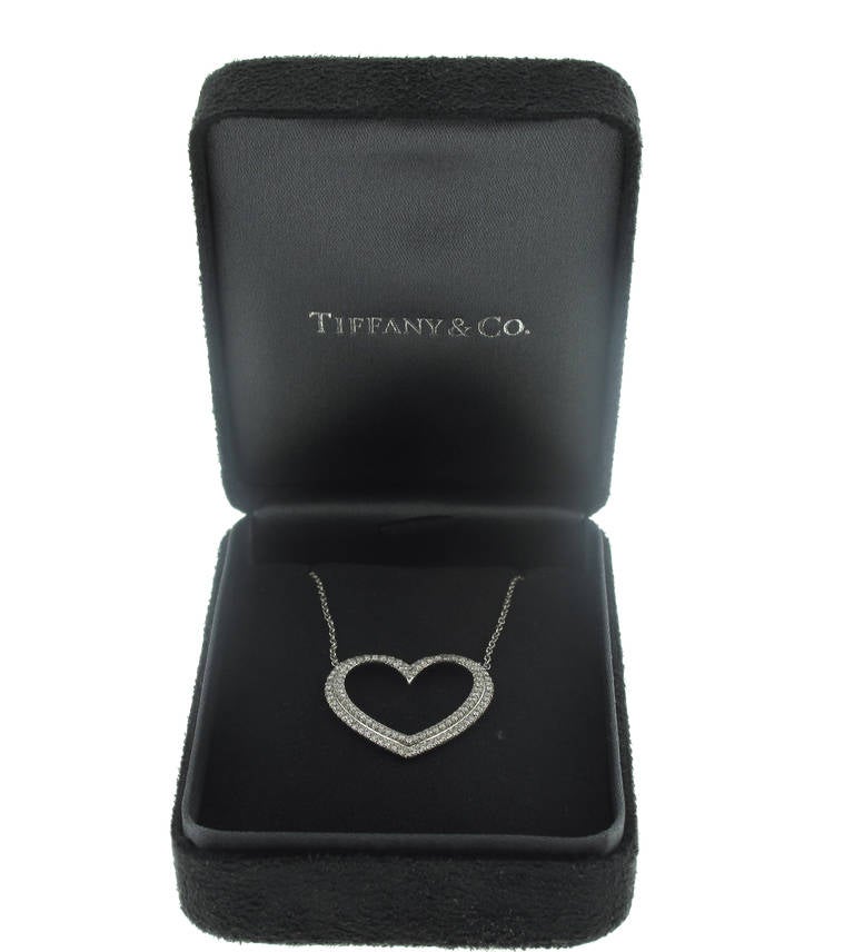 This stunning Tiffany & Co. diamond heart pendant is set in platinum and features 117 diamonds weighing .58 carats.  The chain measures 16 inches in length. The heart measures 1