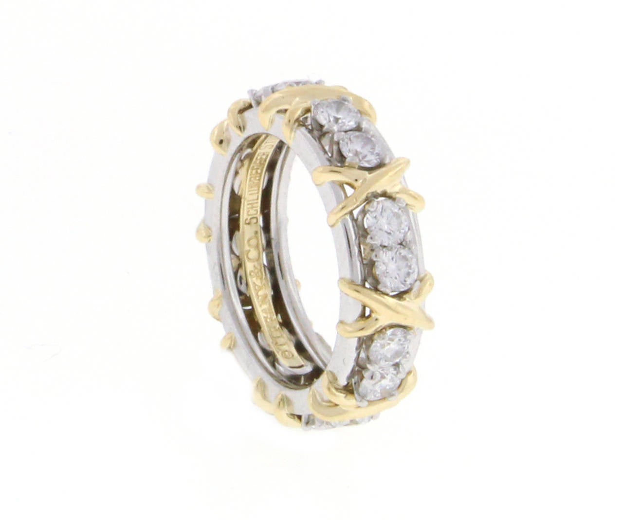 Tiffany and Co Jean Schlumberger’s rendition of an “X,” the popular symbol of love.In  18k gold with round brilliant diamonds in platinum. 16 diamonds weigh  1.14 carats.  size 4 1/2