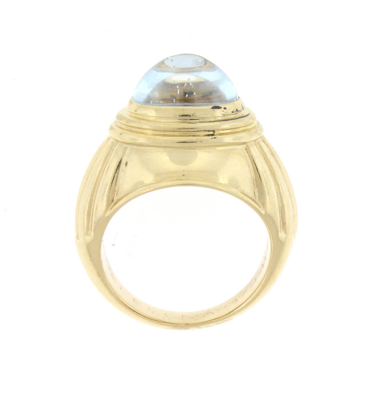 This 18 karat gold ring from the house of Boucheron features a 10 by 6.5mm cabochon aquamarine in an articulated gold setting. Size 51/2 maybe sized