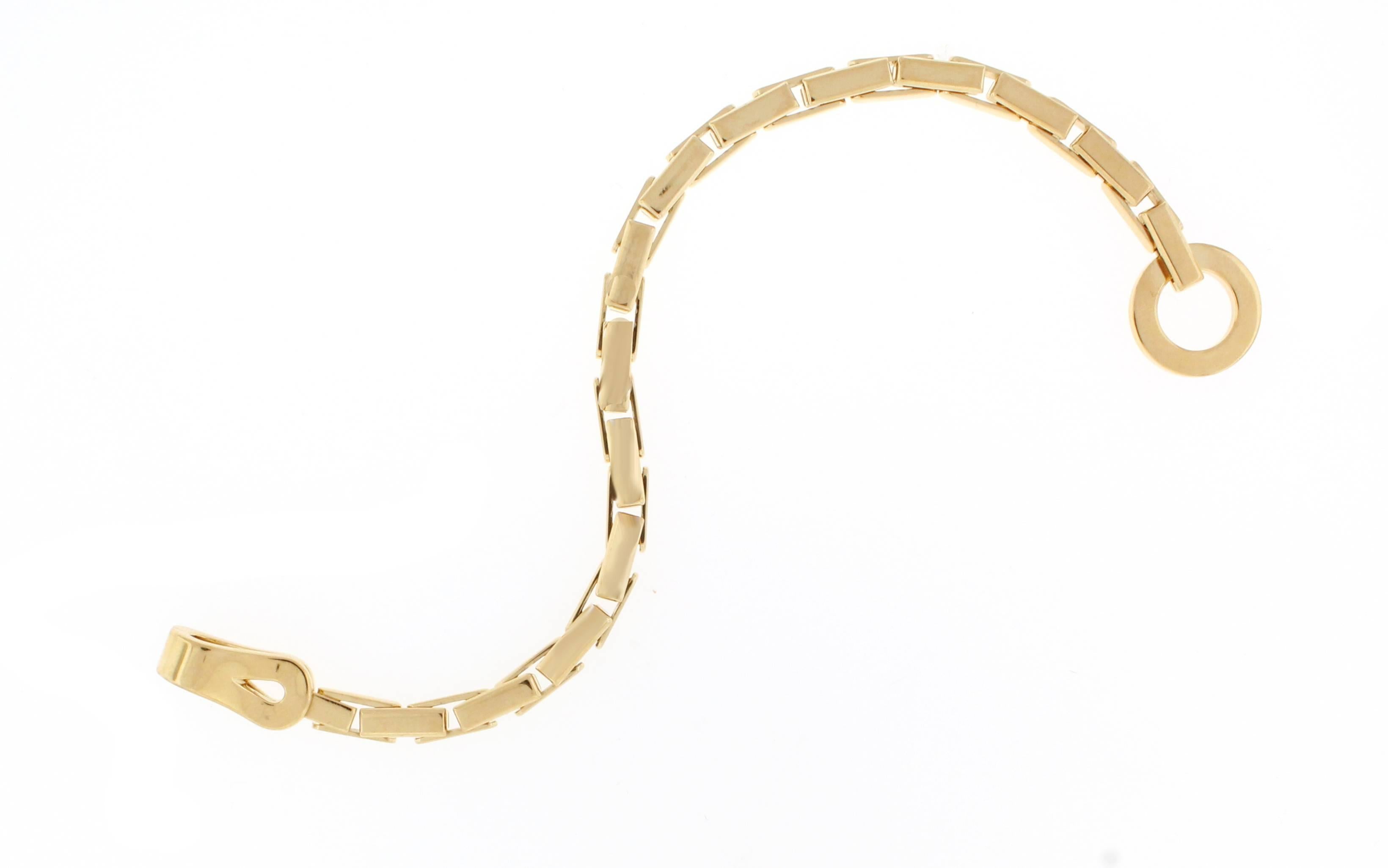 Cartier has borrowed the central motif of this jewelry collection from the world of fashion. Inspired by the clasps of the corsets this 18 karat gold bracelet is refined and sophisticated. 7 1/4 inches

