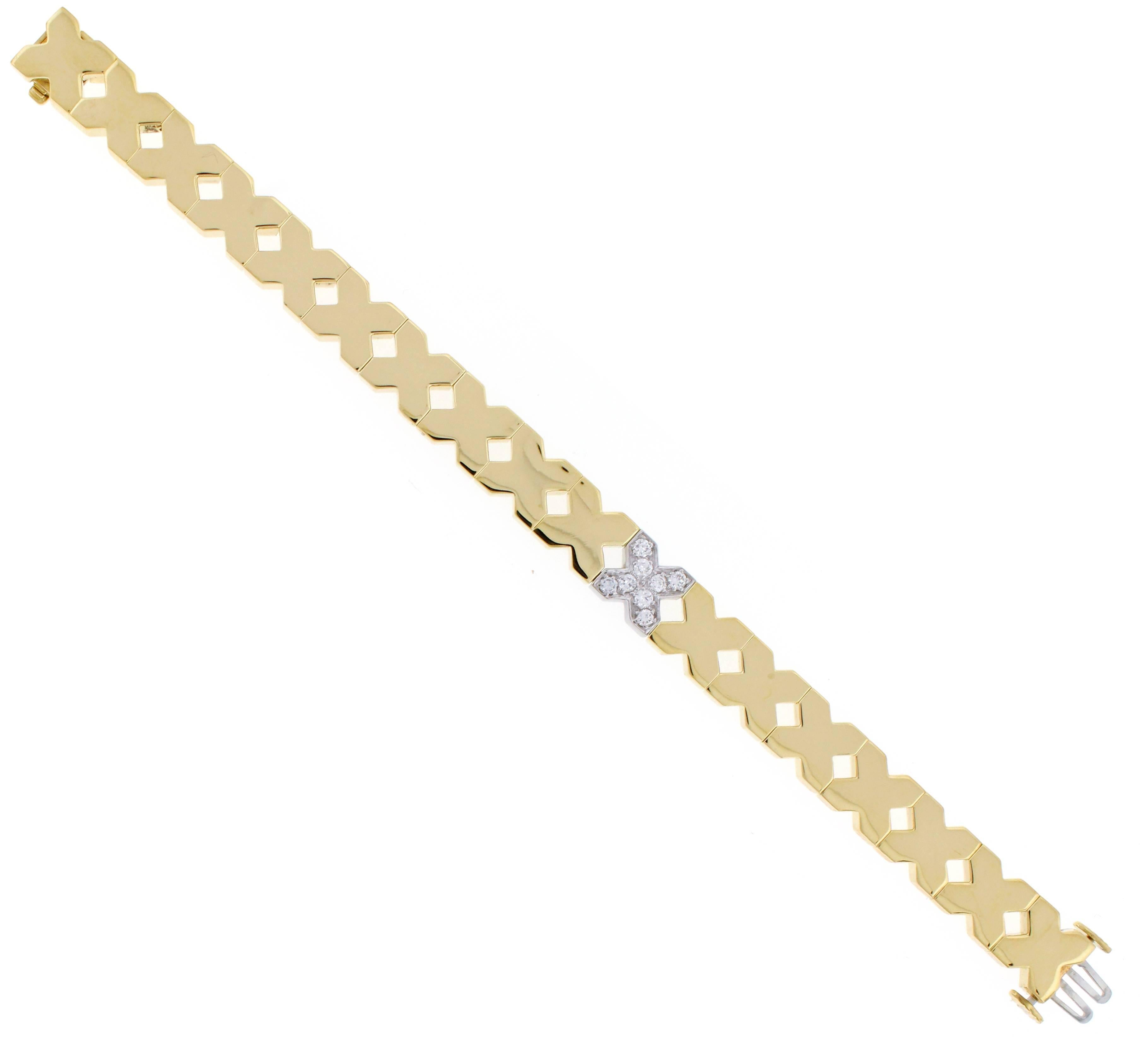 Bold gold X motif links and single diamond X makes this bracelet by Tiffany & Co stylish and sophisticated. Eight  diamonds weigh .40 carats.   6 3/4 inches long. May Be lengthened.
