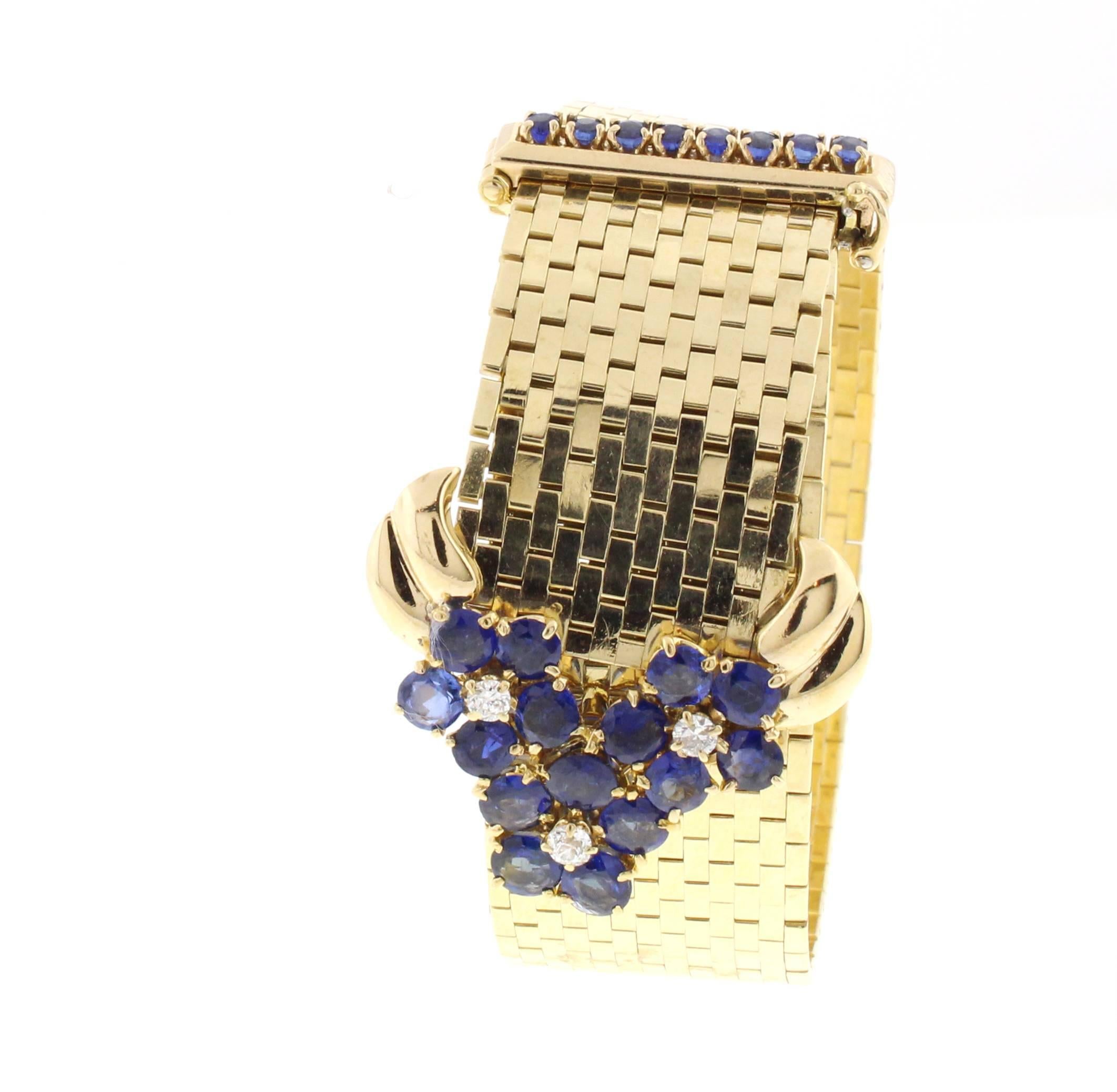 Designed as a flexible gold brick-link strap, with a round sapphires and diamond foliate buckle clasp, and a round sapphire bar.  Set 14 karat gold, circa 1945, 8½ ins., adjustable
Signed Van Cleef & Arpels, N.Y., no. NT 6781

The iconic Ludo