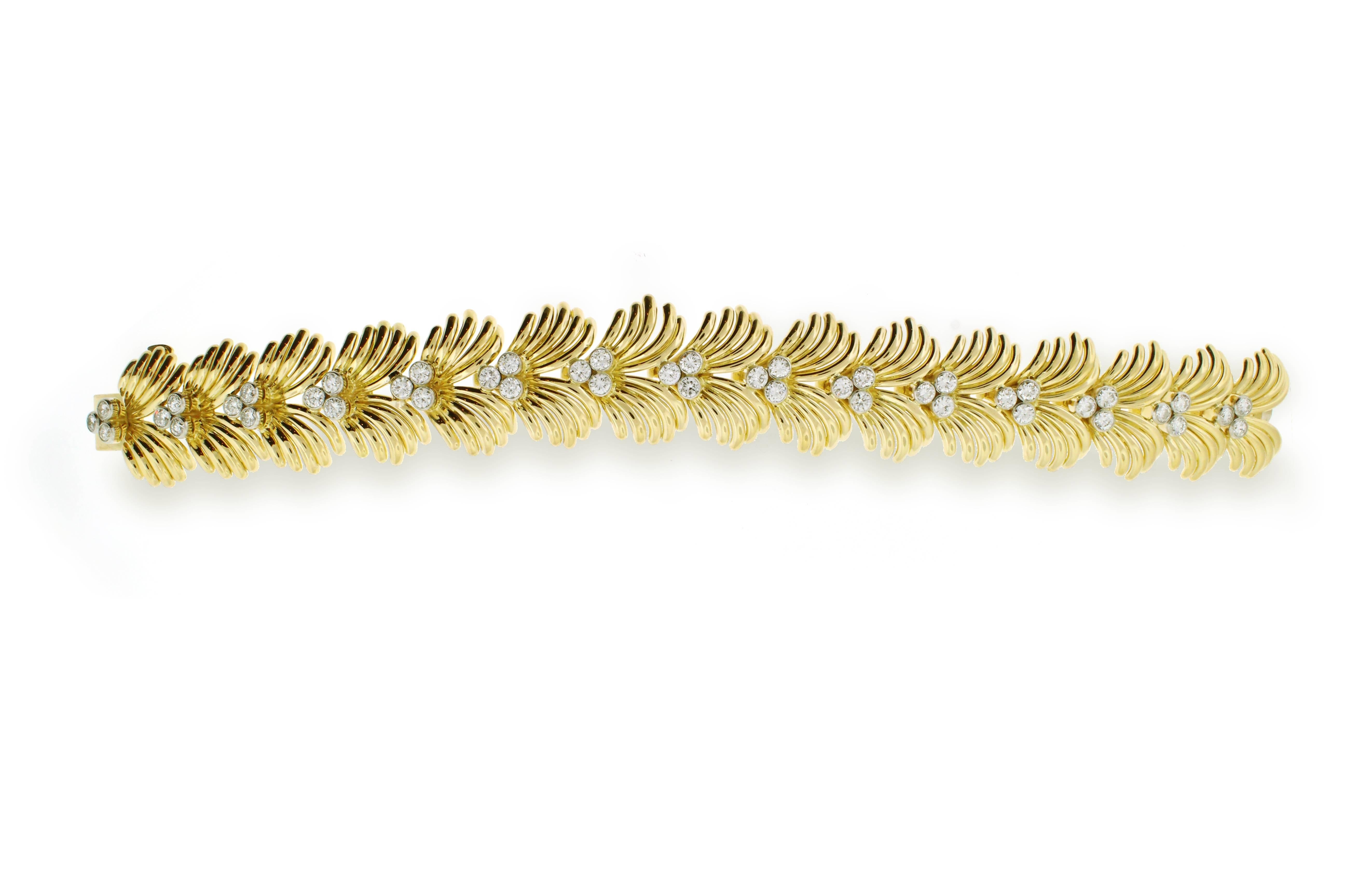 A dramatic diamond and gold bracelet from Van Cleef and Arpels. Comprised of 45 shimmering diamonds weighing  approximately 6 carats, the bracelet makes a statement day or night. Signed Van Cleef and Arpels, Made in France