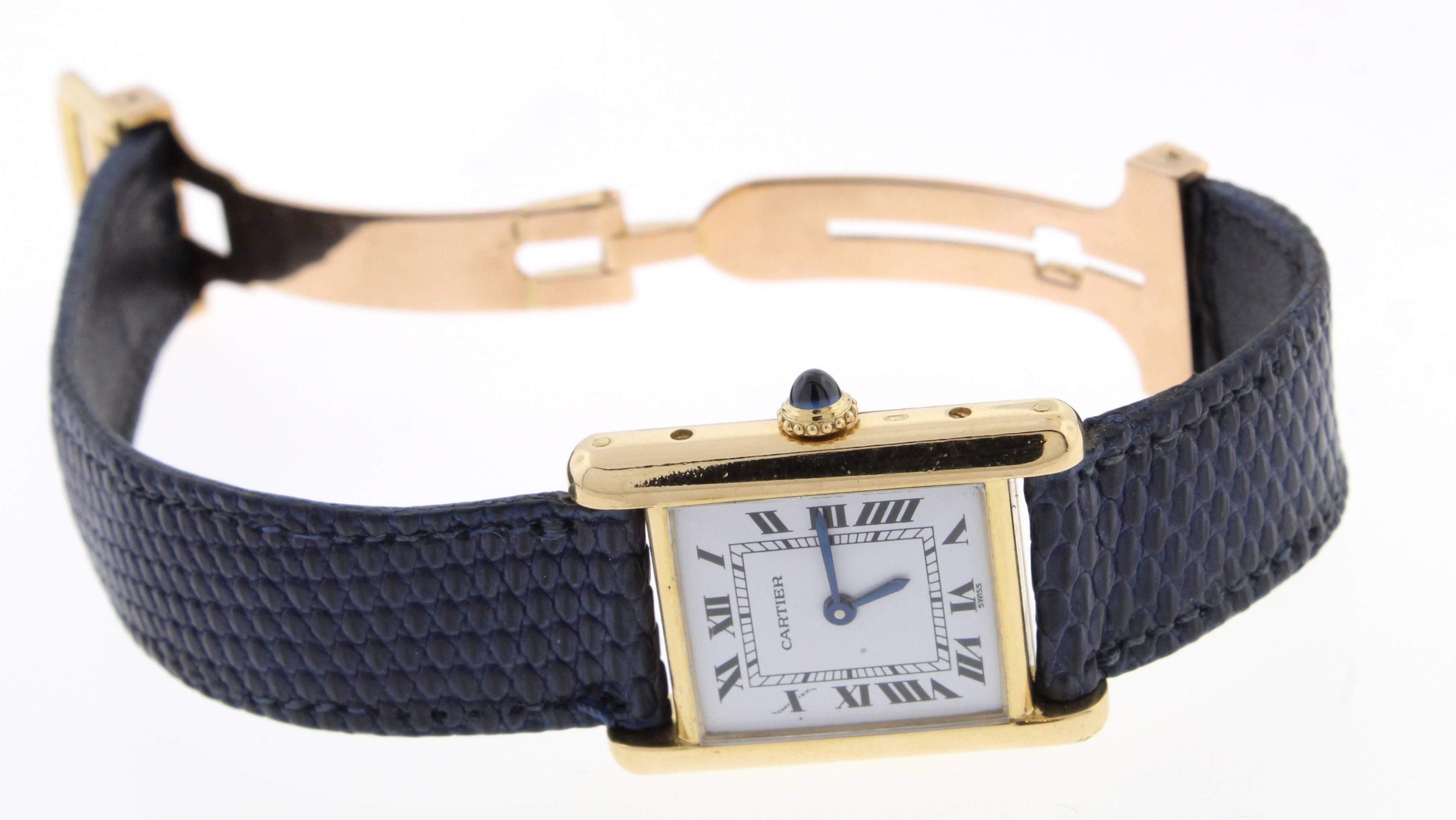  This Cartier Tank Louis 18 karat leather strap watch features a stylish tank case, classic white roman dial with blue steel hands.

Sapphire topped crown
Mechanical movement. 
29mm x 22mm case dimension
Crocodile Blue leather strap
Deployment