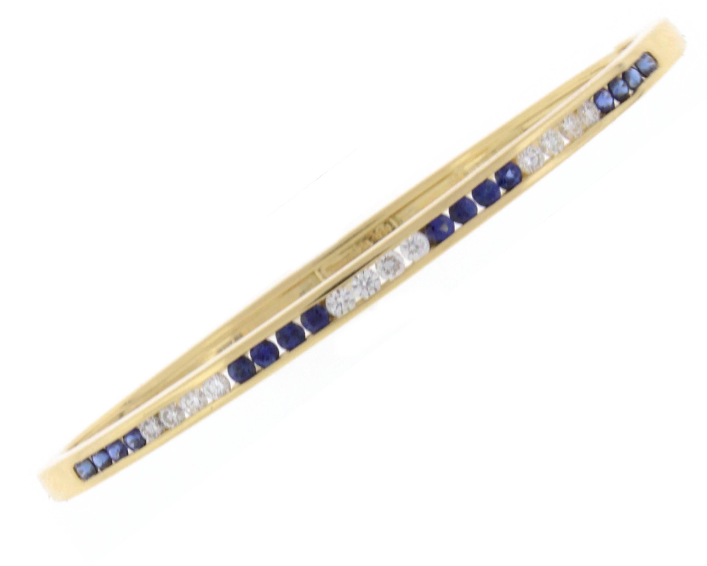 From Tiffany and Co. this 18 karat gold bracelet featureing sixteen sapphires weighing .64 carats and twelve diamonds weighing .36 carats. Fit a 6 inch wrist