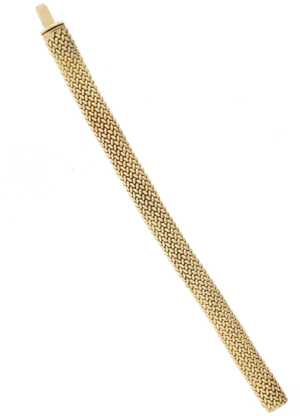 This18 karat yellow gold Tiffany & Co. Somerset Bracelet mesh bracelet is 9.5 millimeters in width.  34 grams. 7.25 inches in length