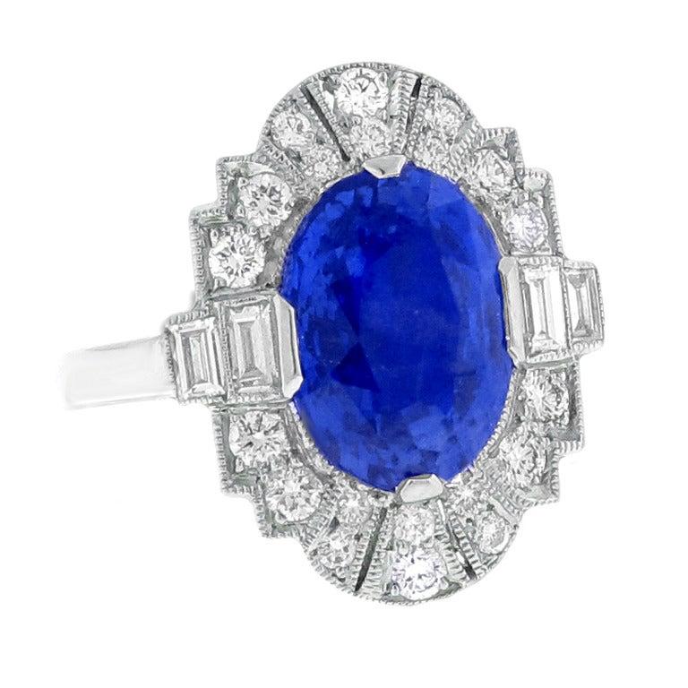 Oval Cut A.G.L Certified 5 carat Ceylon Sapphire and Diamond Ring For Sale