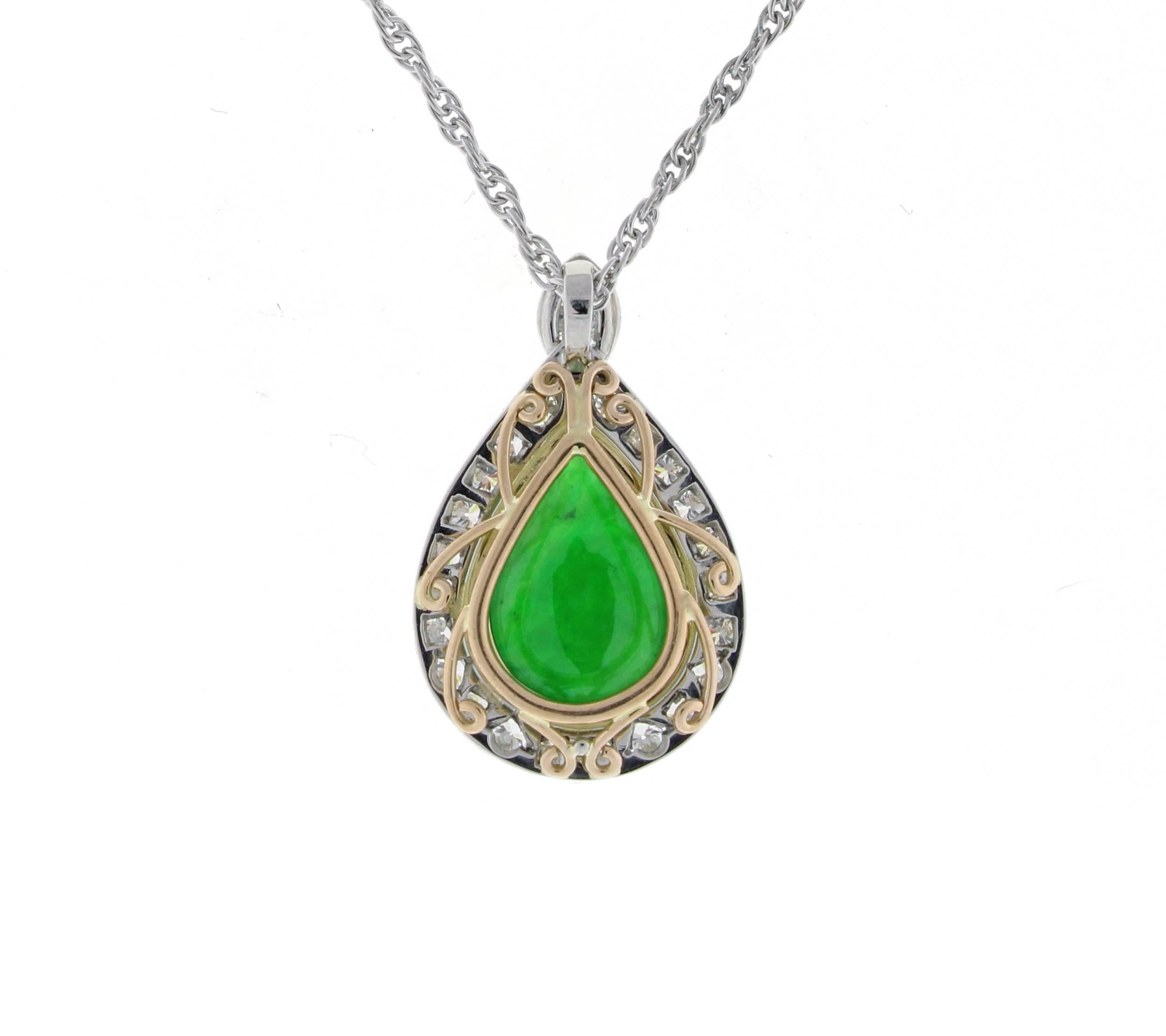 From the master jewelers of Pampillonia, a natural jadeite jade and diamond pendant. The pendant features a pear shaped jadeite jade double cabochon weighing 2.71 carat and 23 diamonds .57 carats. Completely hand made in platinum and 18 akart peach
