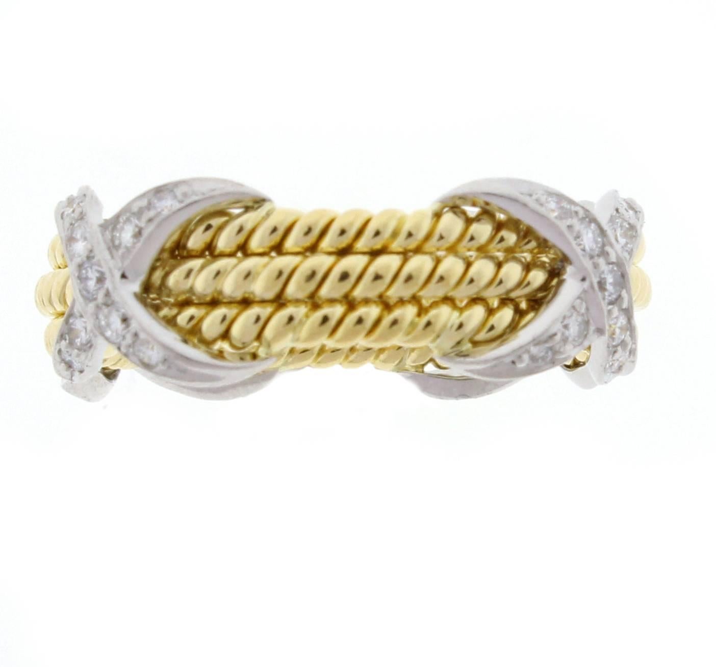 Jean Schlumberger’s visionary creations are among the world’s most intricate designs. Brilliant diamonds illuminate this striking ring.
 18k gold and platinum with thirty-six  brilliant diamonds
 weighting .28  Size 6.5