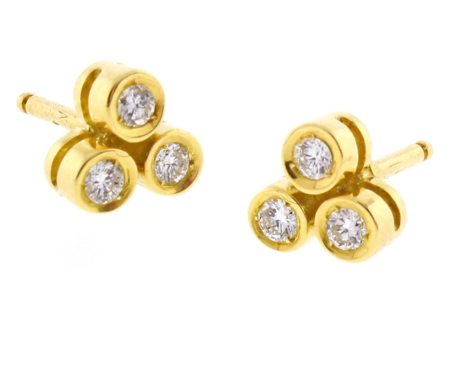 From Cartier their classic three diamond earring. Set with the diamond they are right for any occasion. 6 brilliant diamonds .30 carats self locking earring backs, set in 18 karat gold 