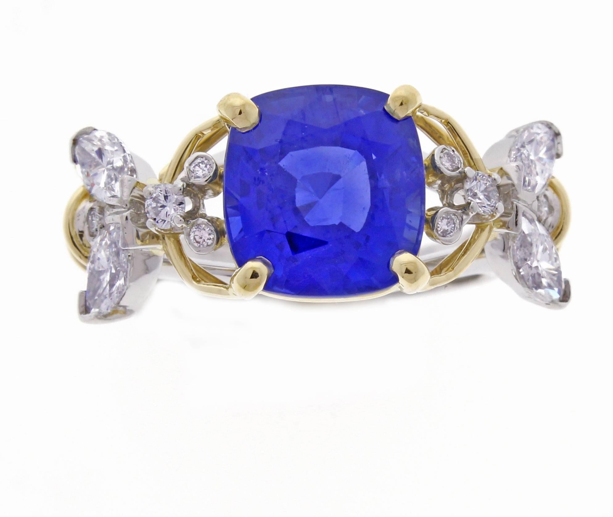 A magnificent gem 5.37 carat unheated Burma sapphire framed by diamonds fashioned to resemble bees, a traditional symbol of royalty. Set in platinum with 18k gold accents signed Tiffany & Co. Schlumberger. 10 Diamond weight.  AGL report accompanies