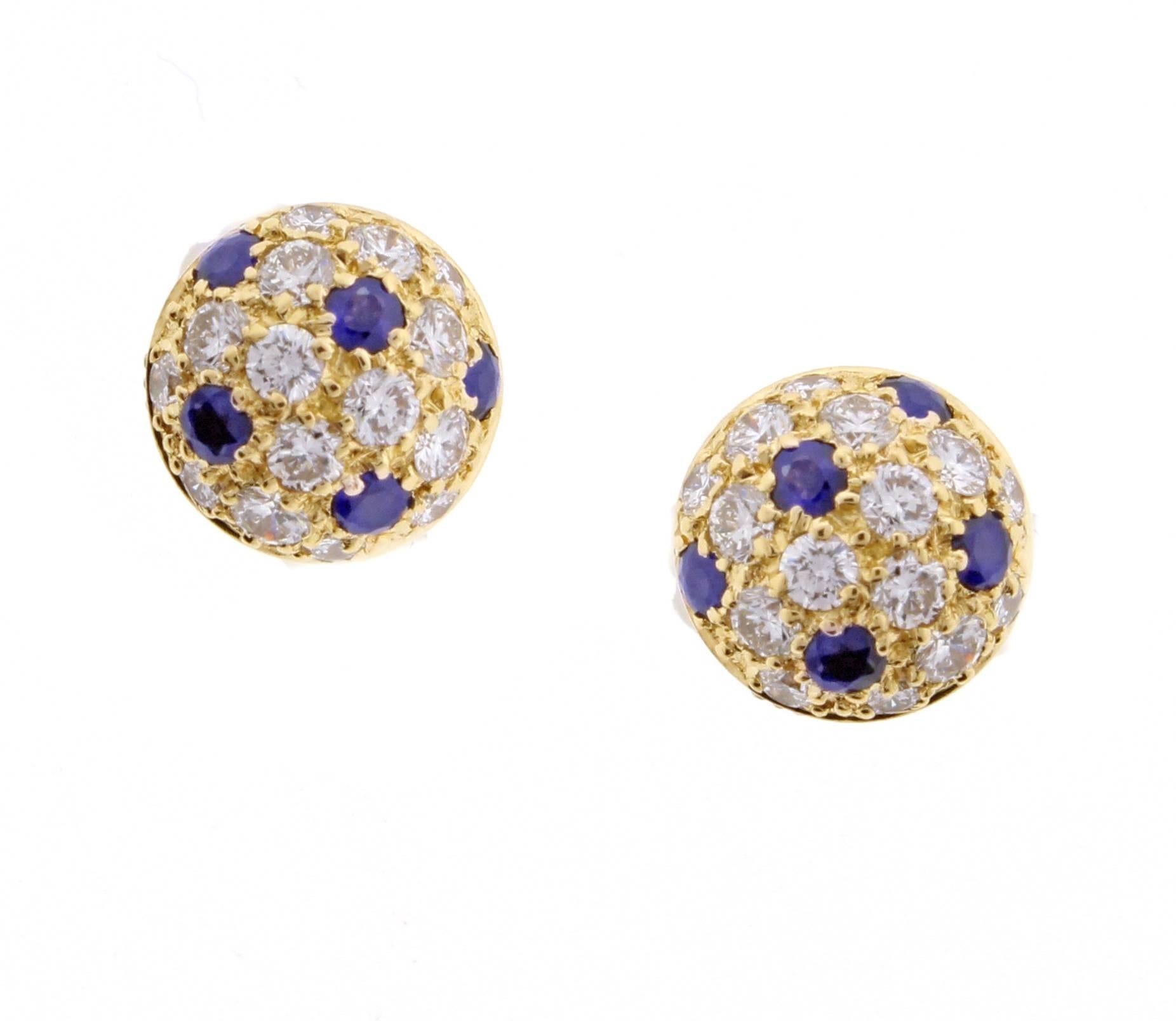 From Cartier, half spheres of pavé set sapphires and shimmering diamonds. Set in 18 karat with .70 carats of diamond and .60 carats of sapphires. 3/8 of an inch in diameter 