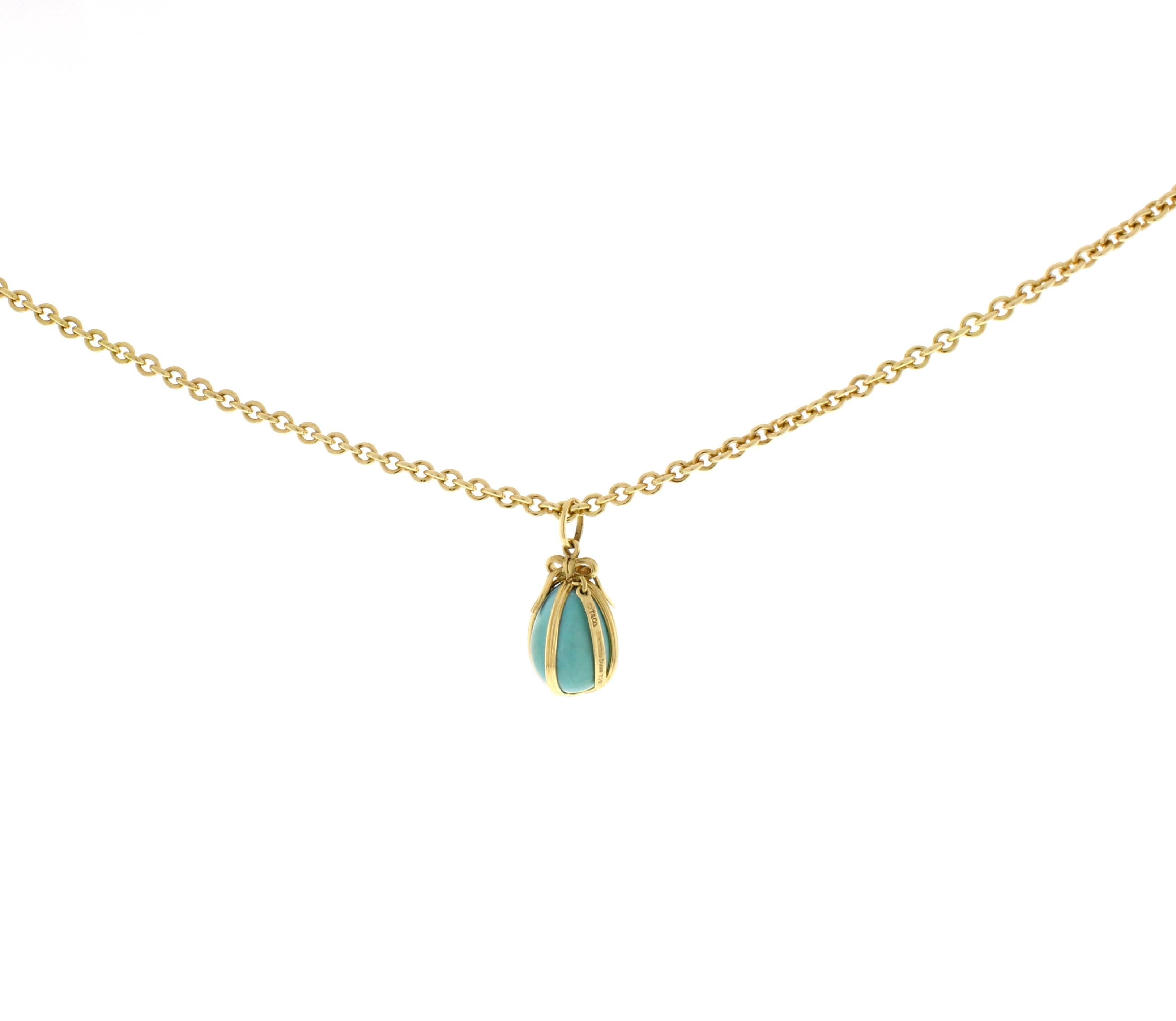 Jean Schlumberger’s visionary creations are among the world’s most intricate designs. A gold ribbon elegantly accents this delicate turquoise charm. Size small 22X13mm, 18 karat gold.  
Tiffany & Co 18kt gold 18 inch medium rolo link necklace  13.3