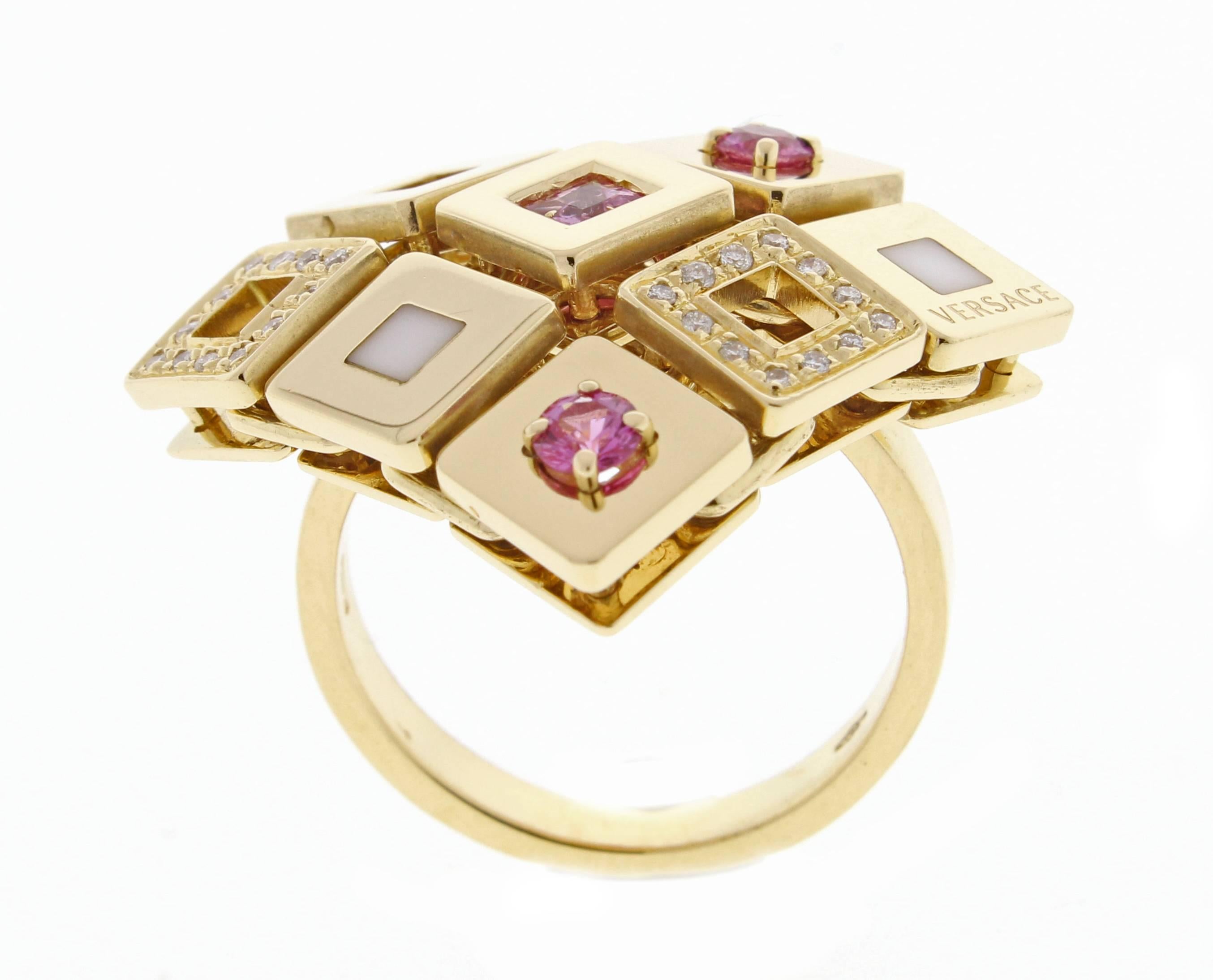 Made from the soft and sensual ‘jewellery fabric’ created by Gianni Versace in the ’80s, this 18-Karat gold ring is part of the geometrically modular Maia collection. 24 Diamond weight .24 carats. 20mm square