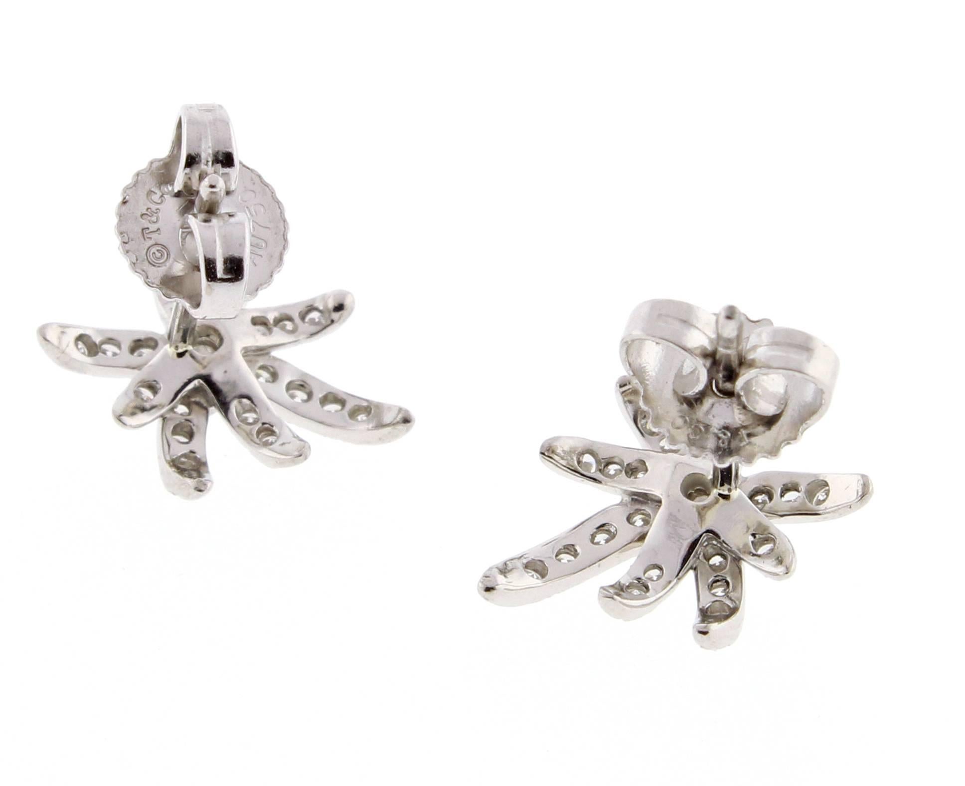 These dazzling earrings feature of burst of fiery diamonds. 42 brilliant diamonds weigh .28 carats, Set in platinum