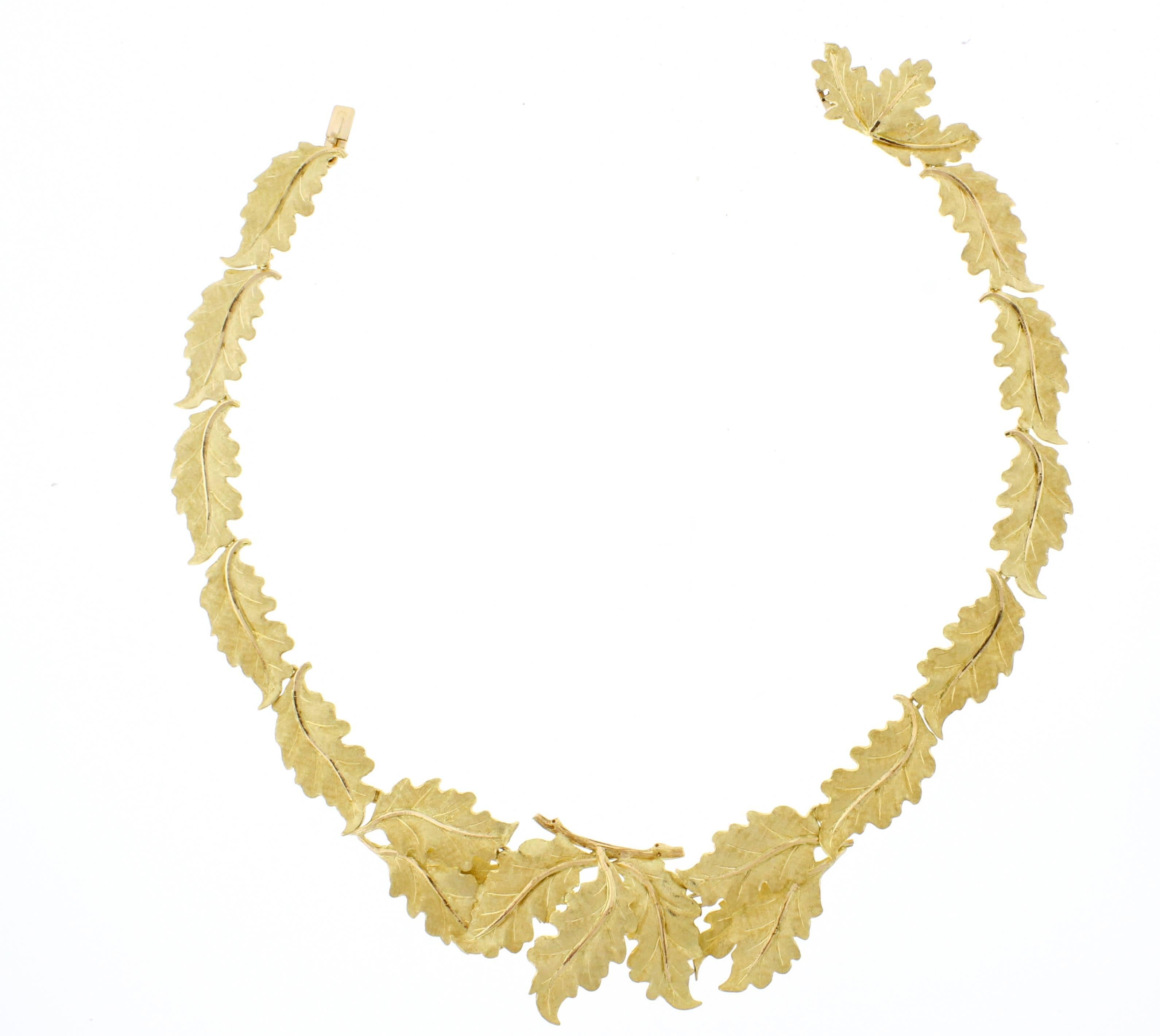 18 karat yellow and pink gold oak leaf necklace, signed M.Buccellati. The necklace is measures 15 inches long and  5/8 of an inch wide . The hand engraved leafs are accented by a pink gold petiole and a center pink gold axil.