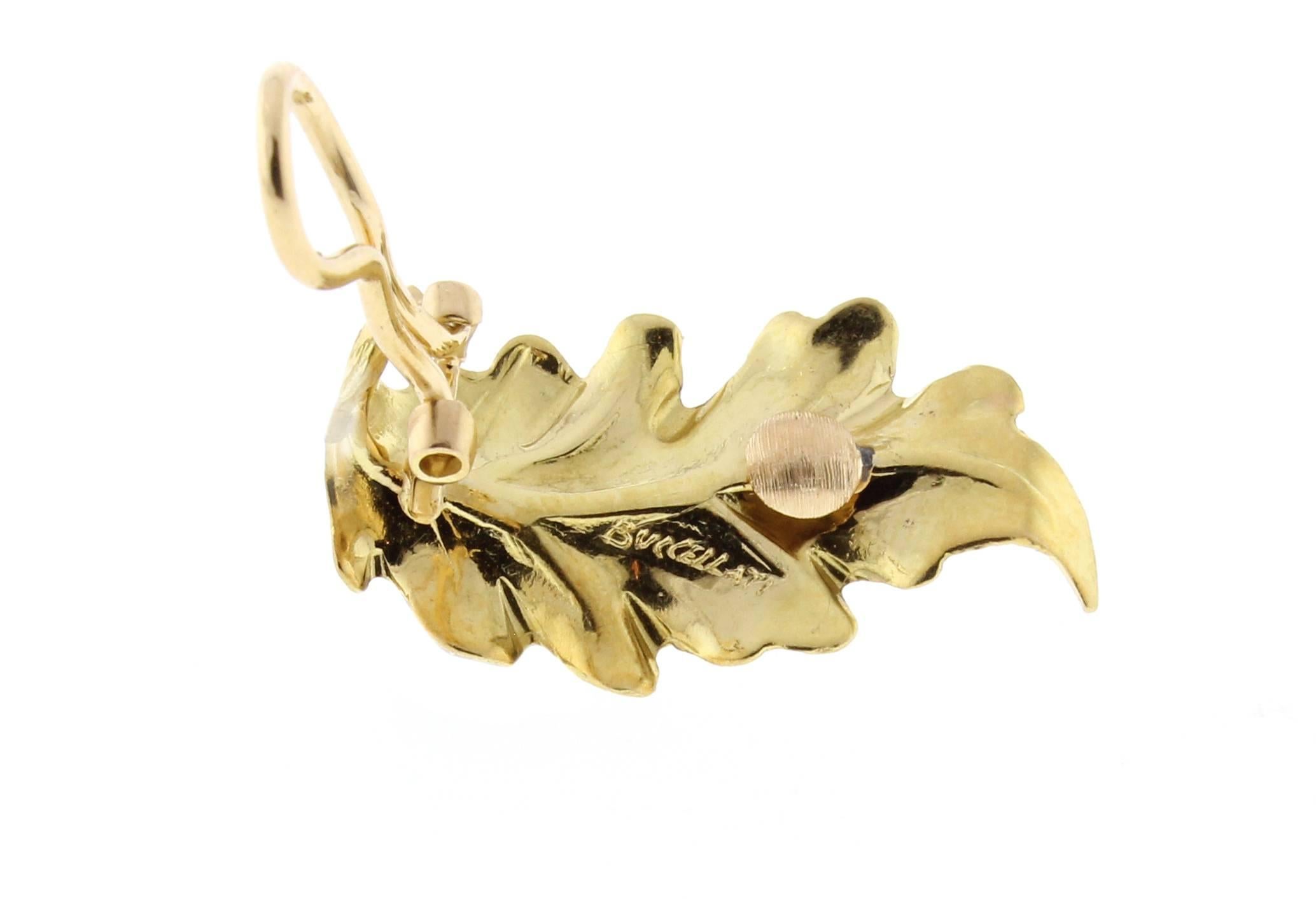 These timeless classic oak leaf  earrings from Buccellati are meticulously hand crafted from 18 karat yellow and pink gold.  Measuring 1 1/8  of an inch long and 5/8 of an inch wide. 7.9 grams. Signed Buccellati