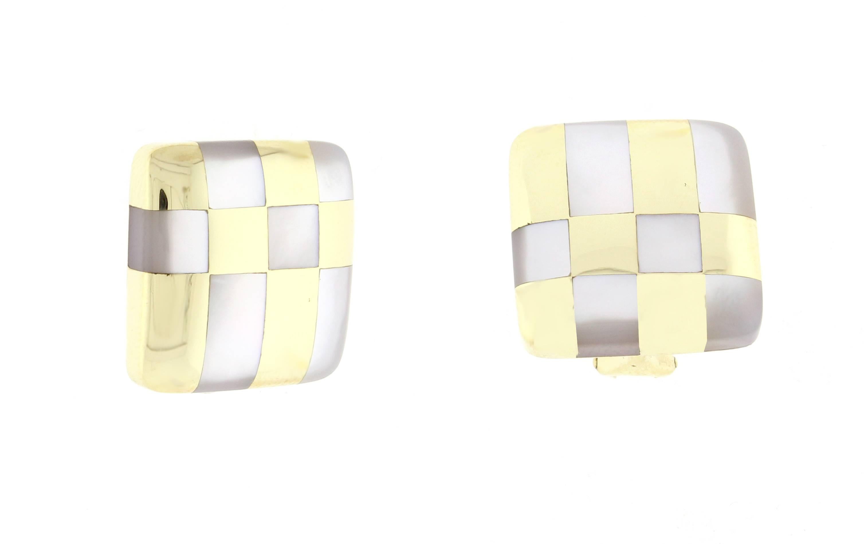 These 1980s earrings from Tiffany & Co are chic and sophisticated. Alternating squares and rectangles of mother of pearl and 18 karat yellow gold create modern geometric look.  3/4 of an inch square