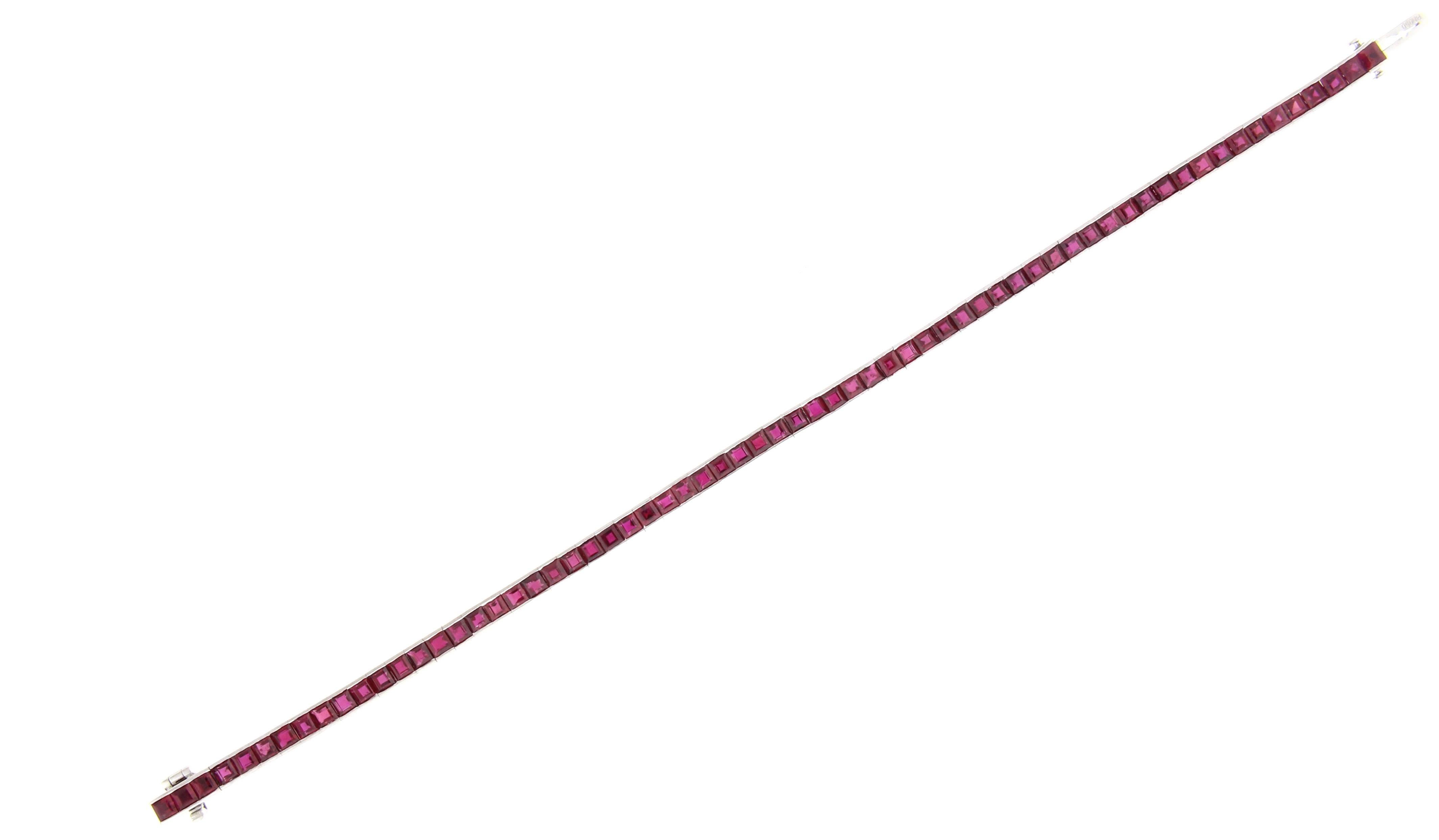 Add a splash of color with this ruby straight-bracelet. The bracelet is comprised of 65 square cut rubies. weighing approximately 9.58 carats. 1/8 of an inch wide seven inches long