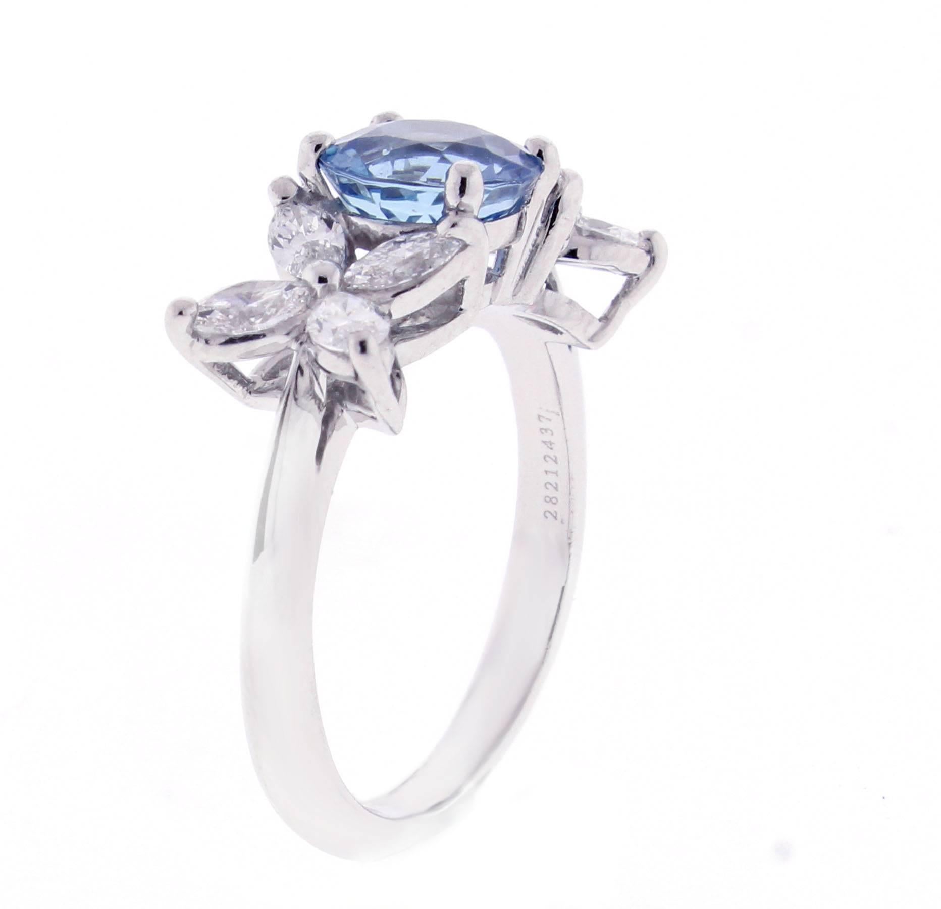Marquise diamonds blaze like stars that light the night. The Victoria setting by Tiffany & Co.makes the perfect setting for this round  Santa Maria  deep blue Aquamarine. The aquamarine has a 7mm diameter with a calculated weight of 1.20 carat. The