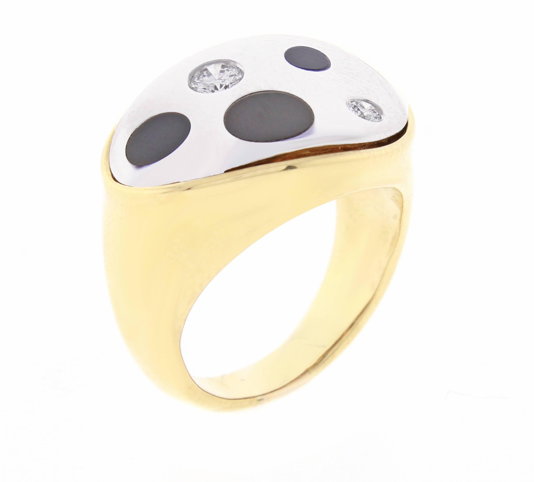 Michael Bondanza jewelry is internationally recognized for its innovative combination of platinum and gold. This ring is part of the polka-dot collection, fusing platinum with 18 karat gold with dots of brilliant diamonds and black onyx.  2 Dia=.24