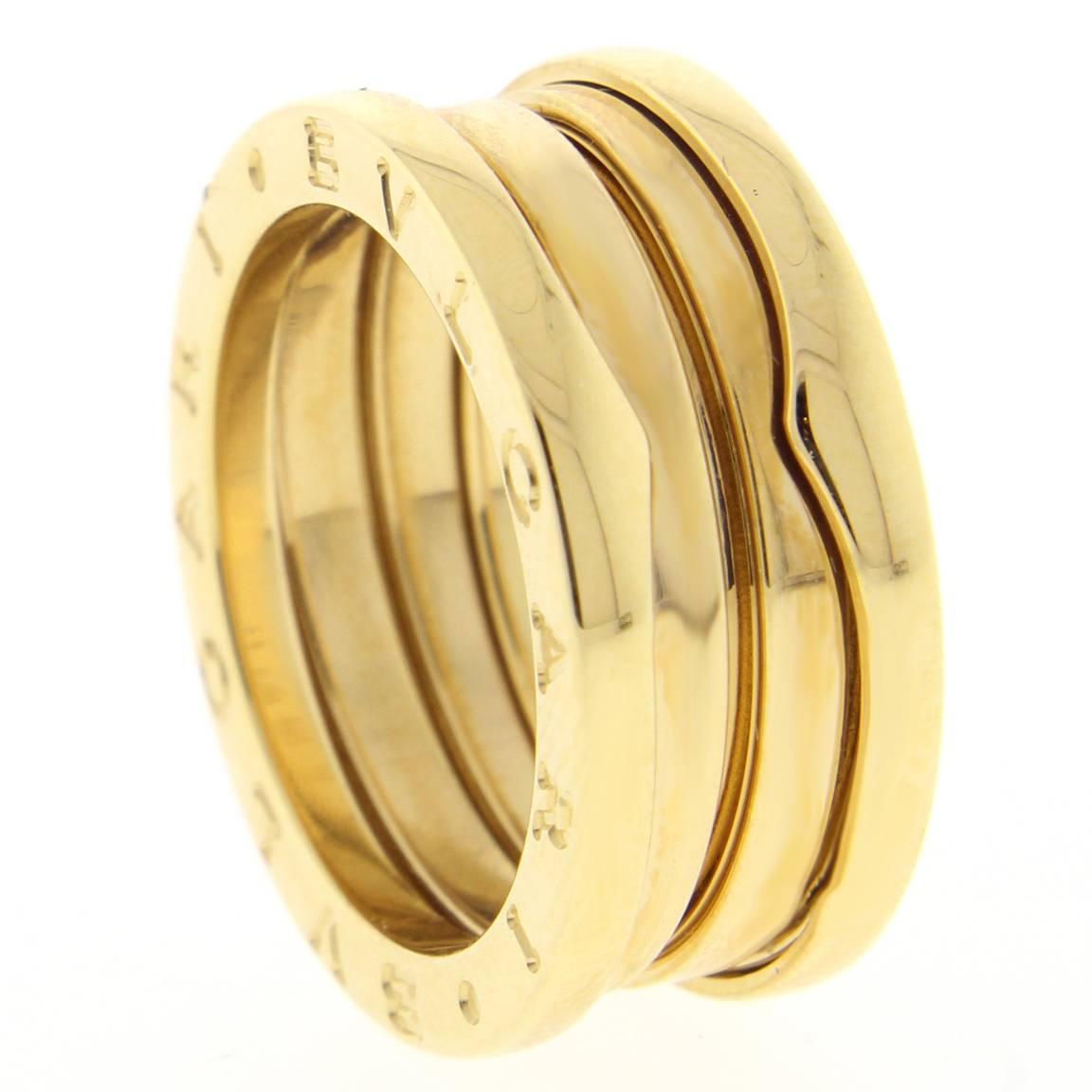 18 karat yellow gold Bvlgari Bulgari B. Zero 3 Band Ring. The ring measure 8.5mm wide,

size 53 US 6.5