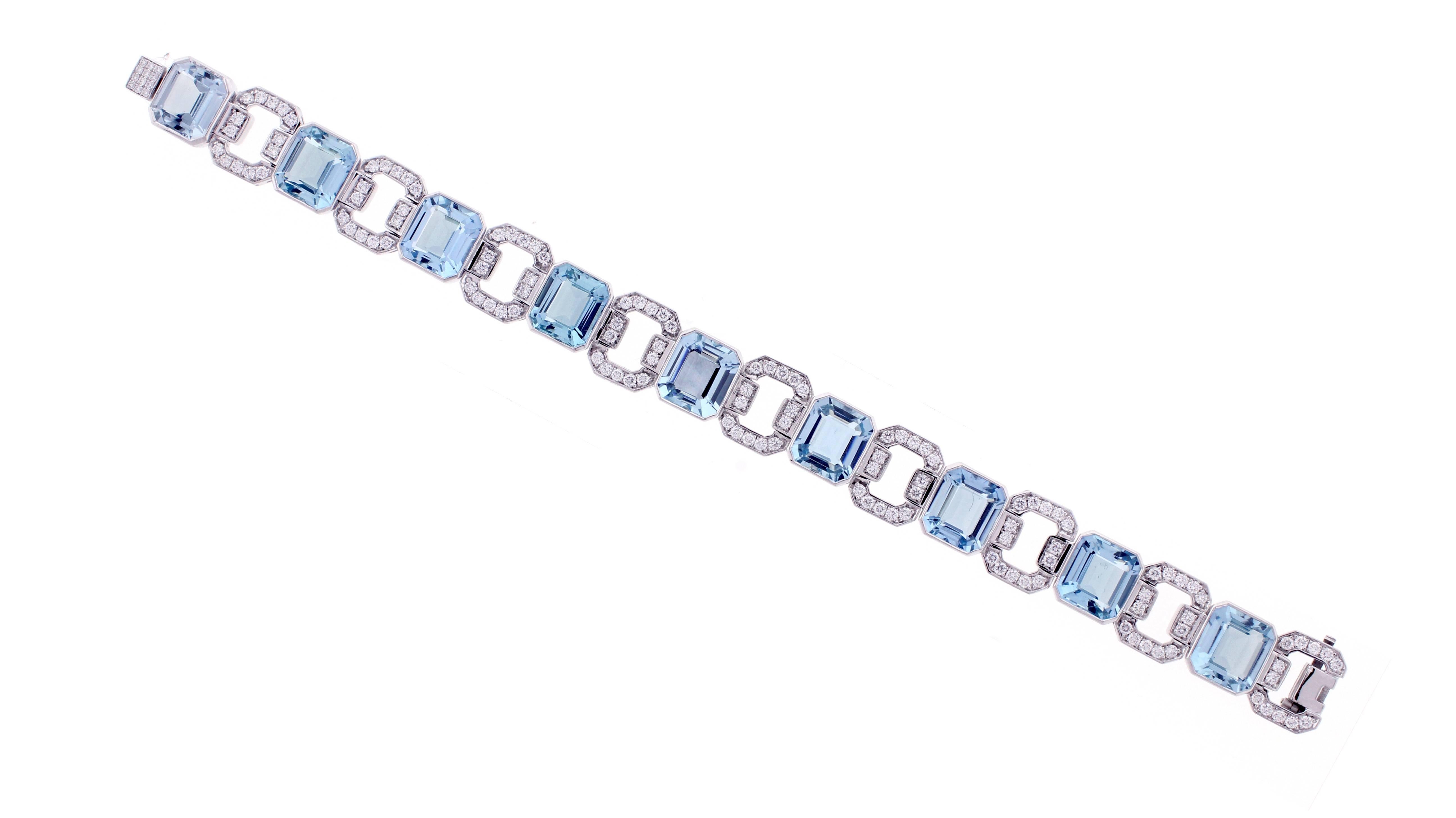 From the master jewelers of Pampillonia, this magnificent aquamarine  and diamond bracelet.  With precise attention to detail and flawless workmanship this  bracelet boasts 9 emerald cut aquamarines weighing 28.10 carats and 136 brilliant diamonds