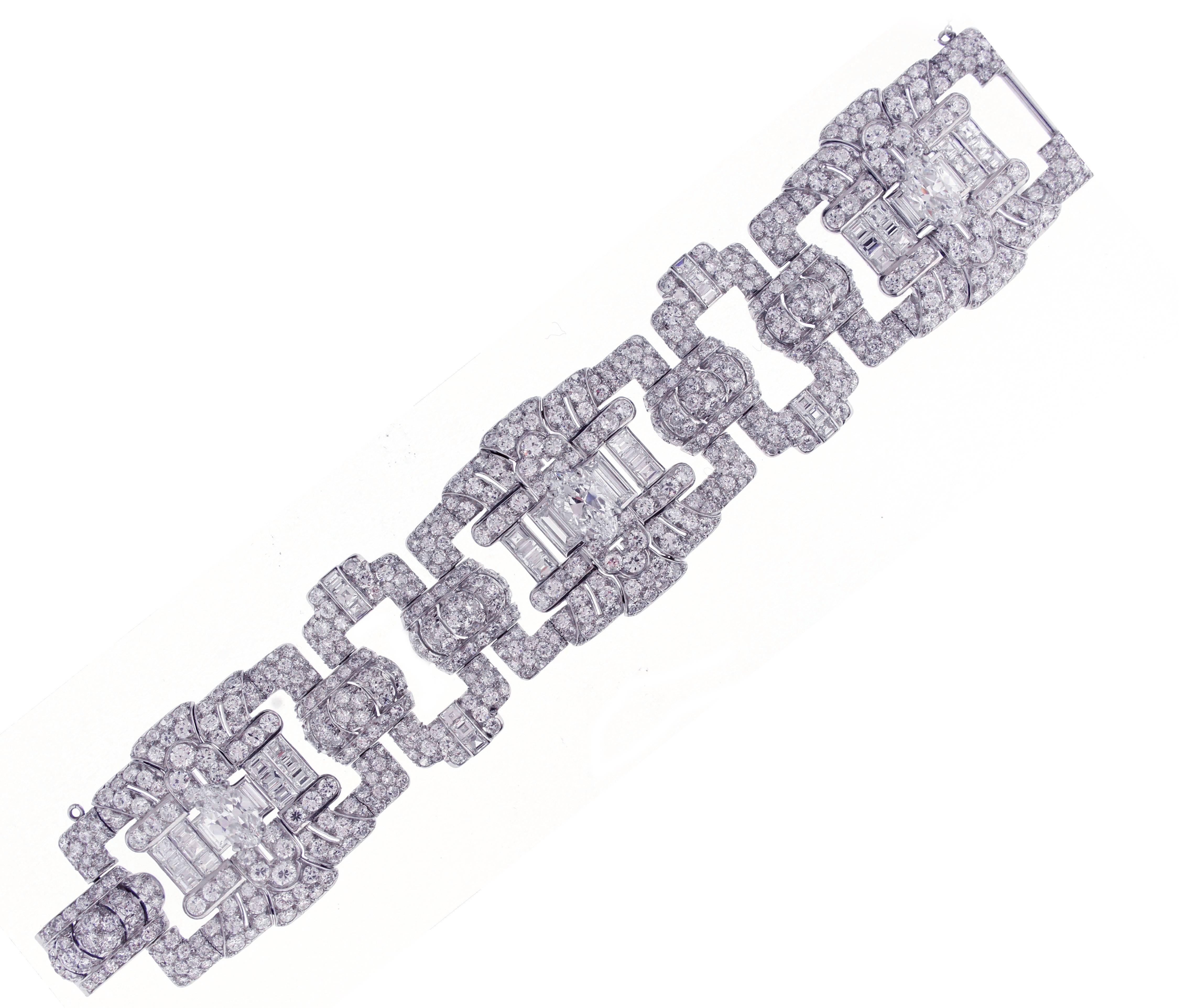 Spectacular wide Art Deco bracelet signed Cartier. The bracelet is comprised of 3 marquise cut diamonds weighing 5.23 carats with an additional 643 diamonds weighing approximately 44.70 carats. The bracelet is signed Cartier on the back of the clasp
