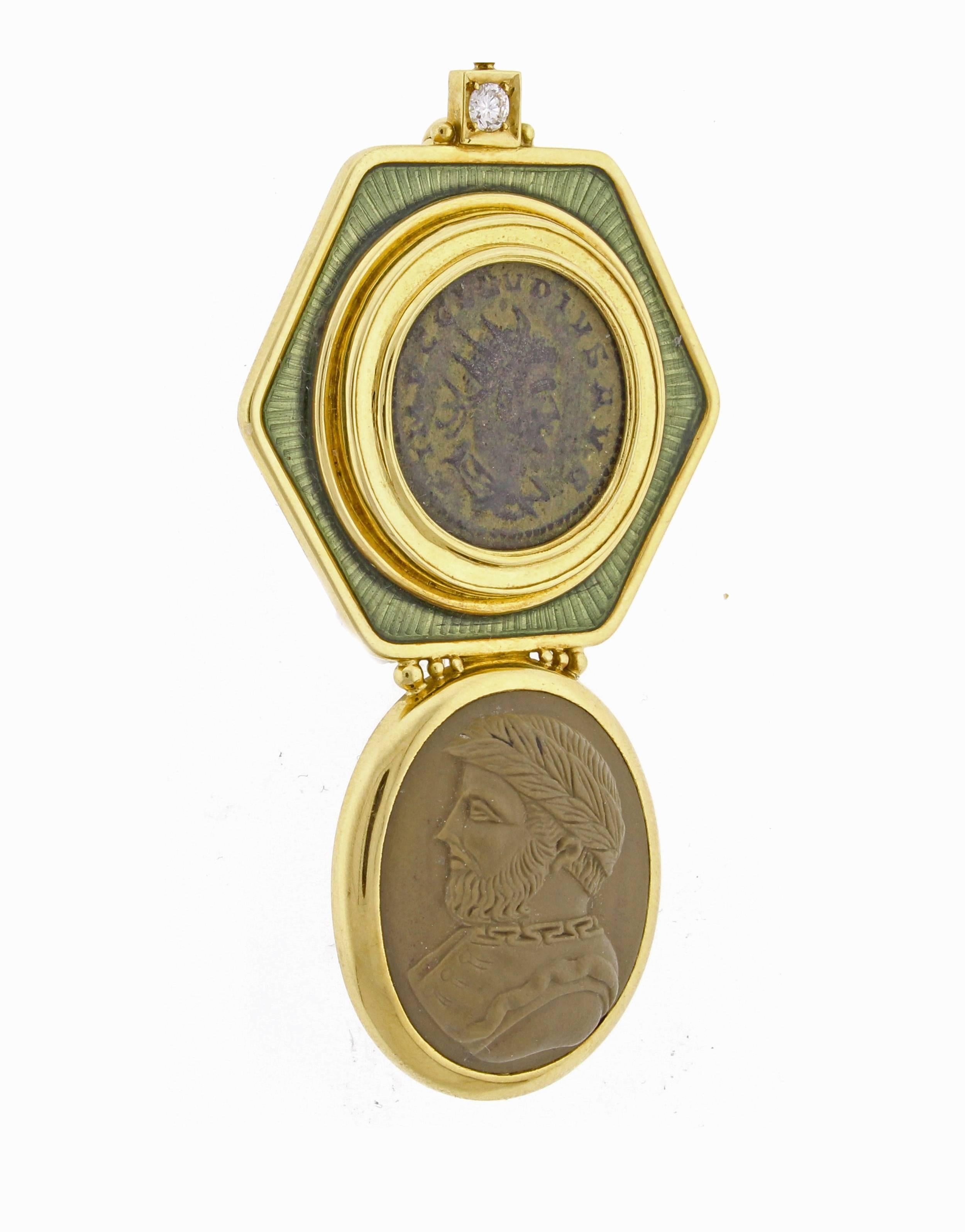 An ancient coin, brilliantly framed with pastel green enamel, sits on top a lava stone cameo in this stunning 18 karat gold brooch by Elizabeth Gage.
