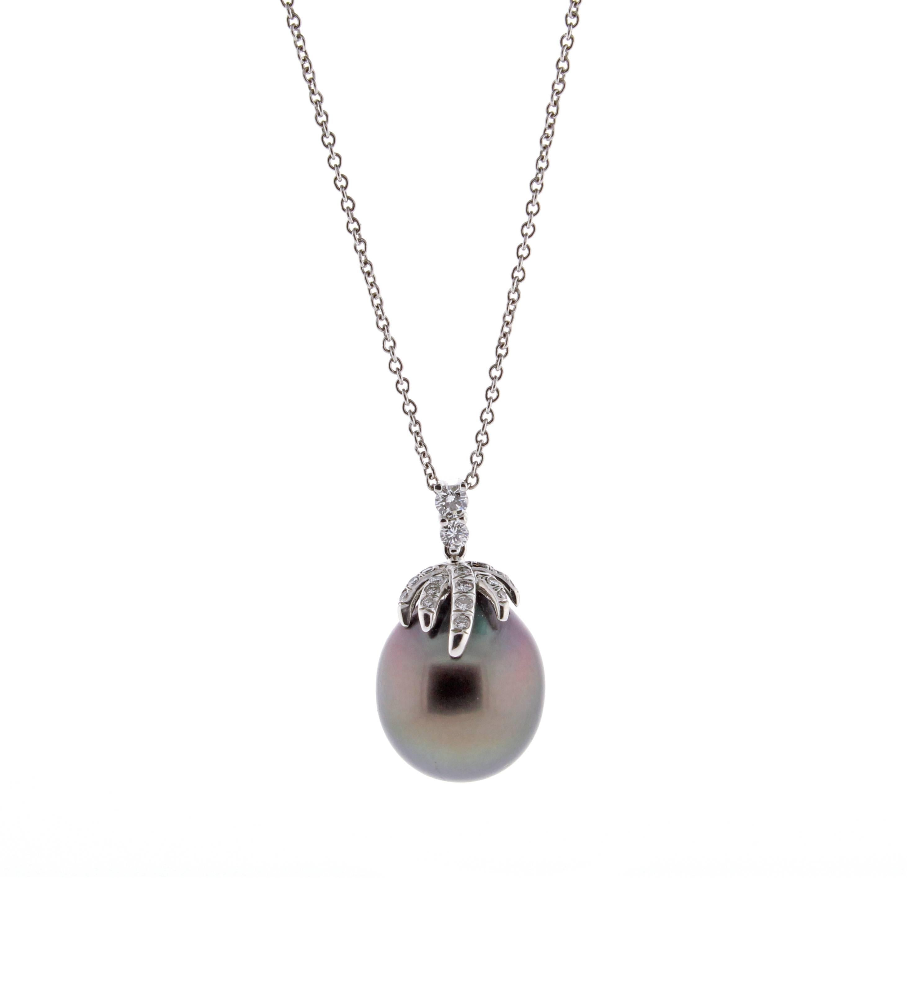 From Tiffany's fireworks collection;  this Tahitian pearl and diamond necklace. The magnificent  Tahitian south sea pearl measures 14 by 12mm with 22 brilliant cut diamonds weighing .14 carats. Set in platinum, 24 inch Tiffany & Co  platinum