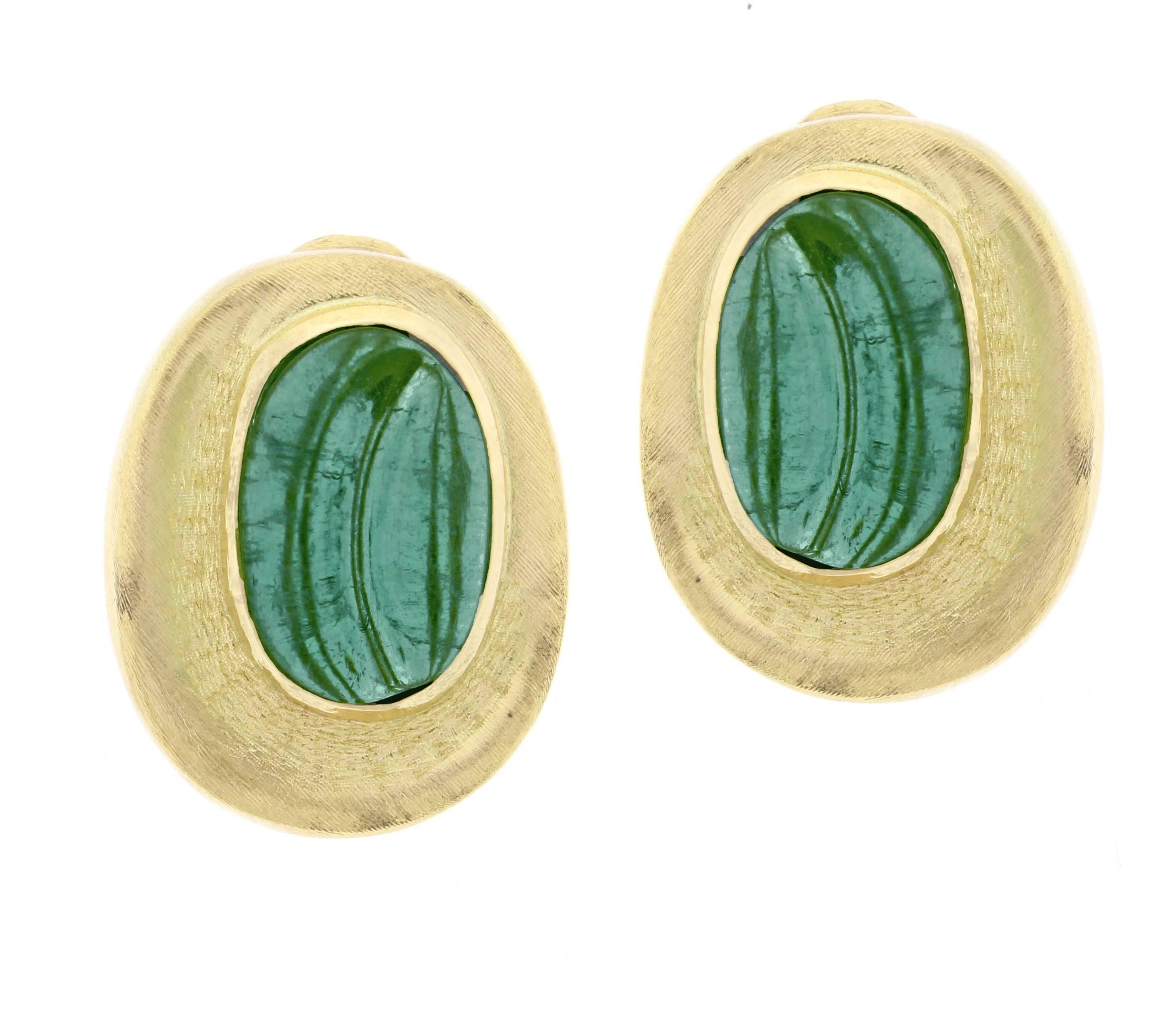 Intricately carved tourmaline earrings in the “forma livre” (free form) style. Haroldo Burle Marx was particularly known for his use of large gemstones, often fashioned by carving or tumbling. The carved bluish green tourmalines measure 15*9mm the