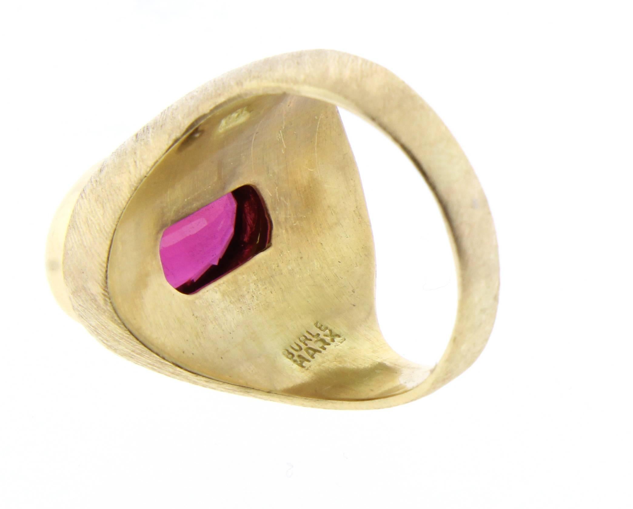 A rubellite tourmaline and diamond ring by world renowned Brazilian jeweler Haroldo Burle Marx (1911-1991). The ring features a bezel 12*9mm oval red tourmaline weighing 5 carats 13 diamonds weighing approximately .35 carats set in a brushed 18