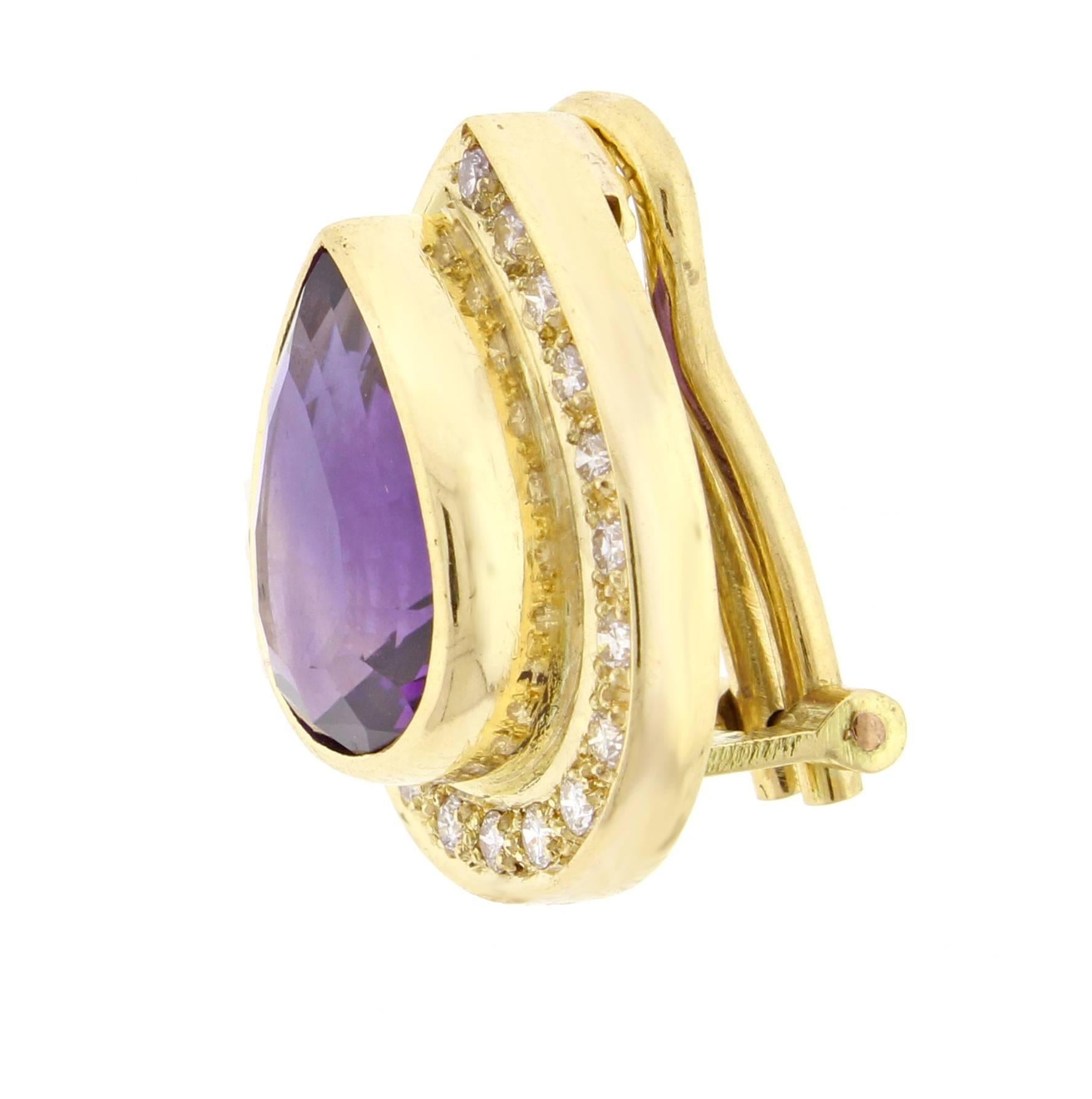 Pear-shape and diamond Earrings by world renowned Brazilian jeweler Haroldo Burle Marx (1911-1991). The ring features  bezel 12*10mm pear-shaped amethysts and 28 diamonds weighing approximately .55 carats set in a brushed 18 karat gold setting.
