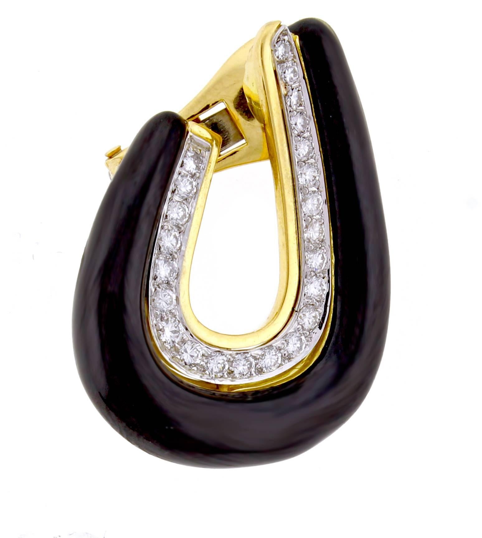 From David Webb, an impressive pair of black enamel and diamond earrings. The 18 karat earrings are comprised of 46 platinum set diamonds weighing approximately 1.25 carats.  1 1/4 inches high 5/8 of an inch wide. 