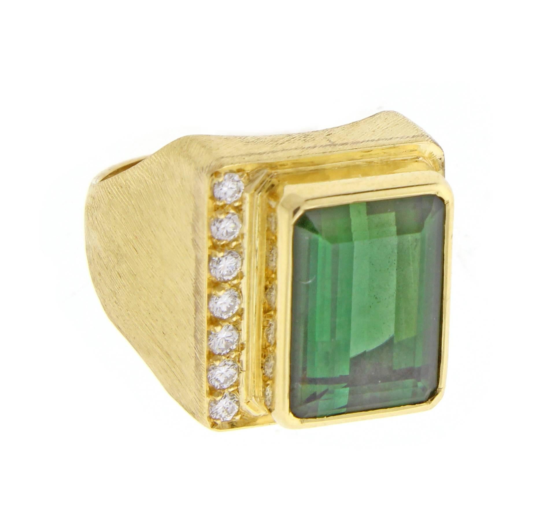 Emerald cut tourmaline and diamond ring by world renowned Brazilian jeweler Haroldo Burle Marx (1911-1991). The ring features a bezel set 12.5*9mm tourmaline and 7 diamonds weighing approximately .15 carats set in a brushed 18 karat gold setting.