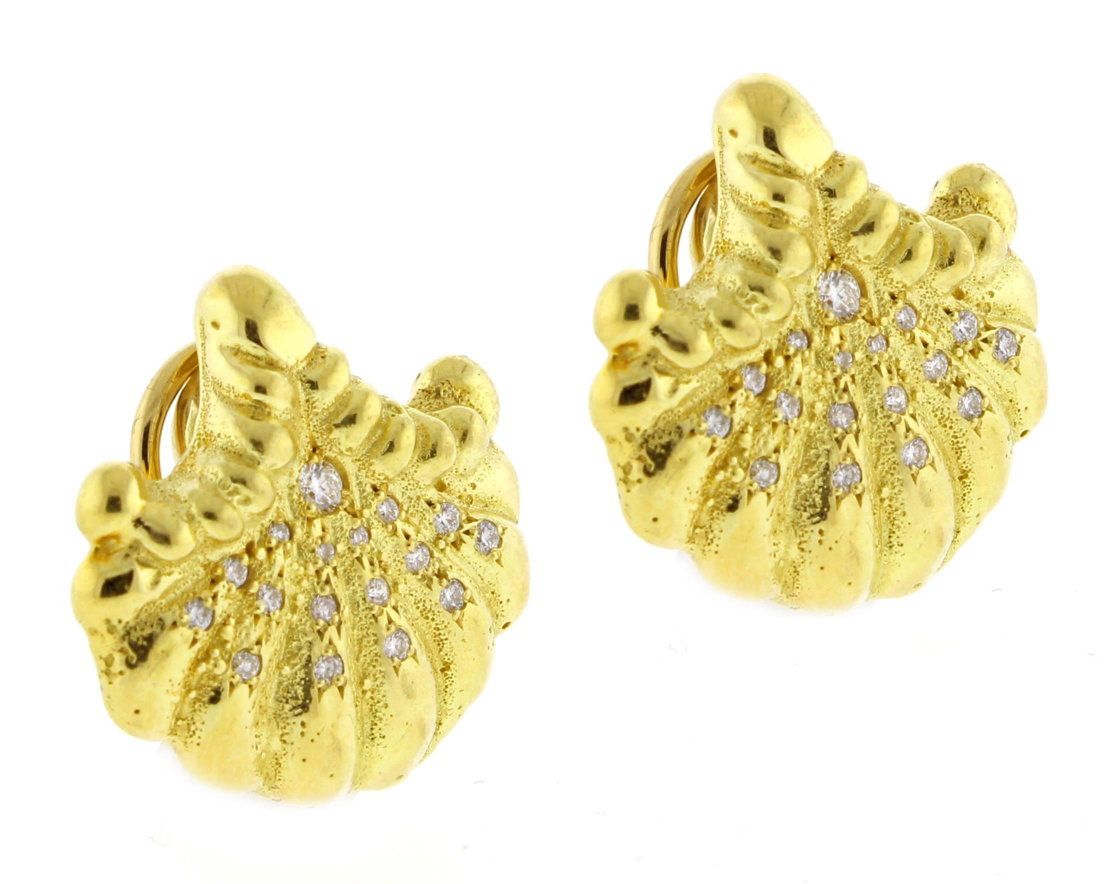 A beautiful pair of 18 karat  yellow gold single shell earrings decorated with thirty-four round brilliant cut diamonds weighing .41 carats and granulation detail.
Approximately /¾ inch from top to bottom. 20.2 grams


