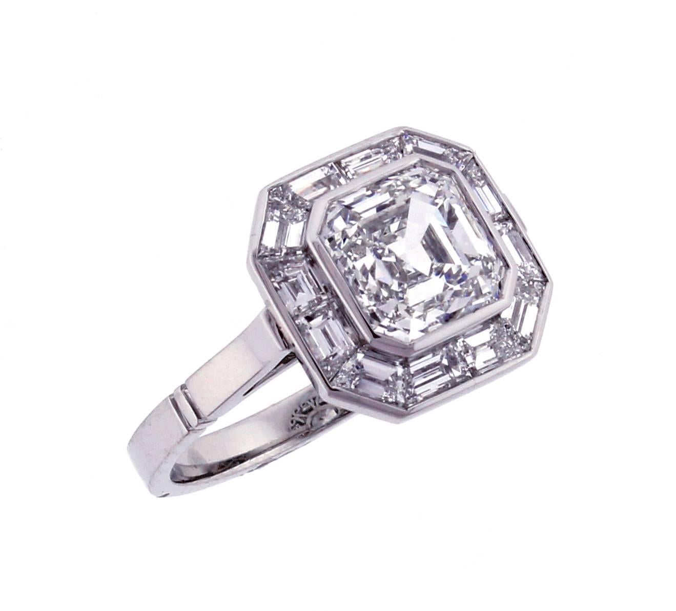 From Pampillonia, this well appointed Asscher cut diamond engagement ring. The center  G.I.A. Asscher cut diamond weighs 2.01 carats,is H color and VVS2 clarity. Twelve specially cut baguette cut diamonds weighing 1.20 carats frame the center