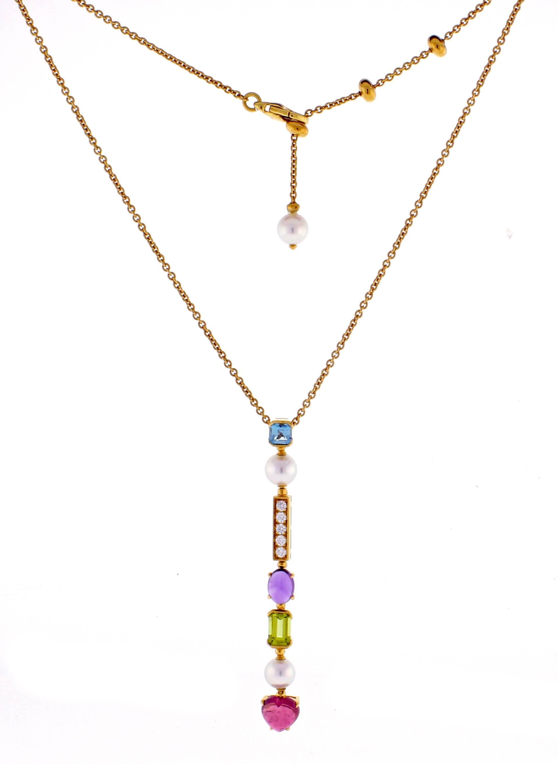 This stunning Bulgaria Allegra multi colored gemstone  and diamond necklace is crafted in 18 karat yellow gold. The necklace is comprized of akoya  pearls, blue topaz, peridot, diamonds and a heart shaped tourmaline. Adjustable from 16-18 inches.